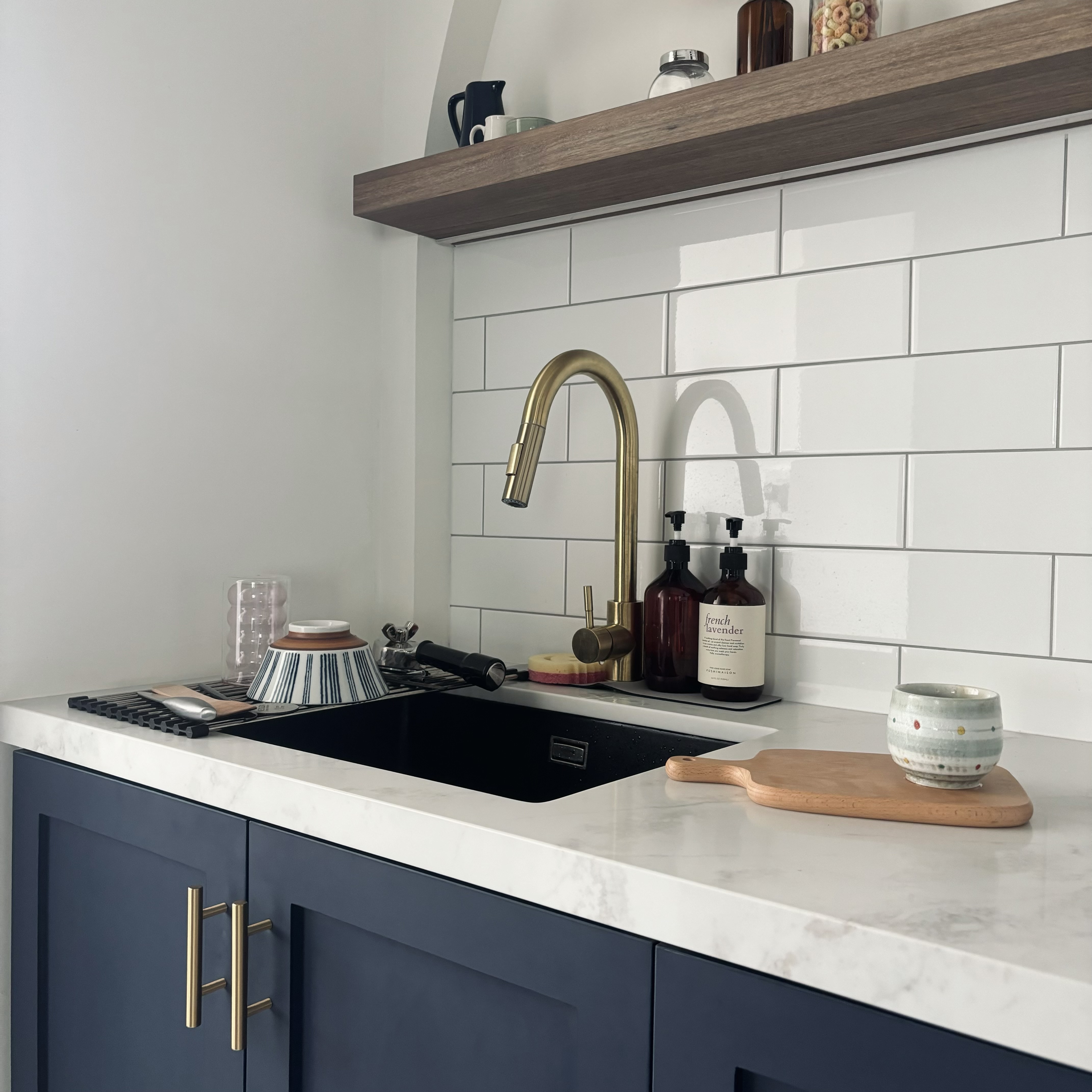 Our blue farmhouse style open concept kitchen!  - modern kitchen countertop, minimalist design, white tiled backsplash, dark