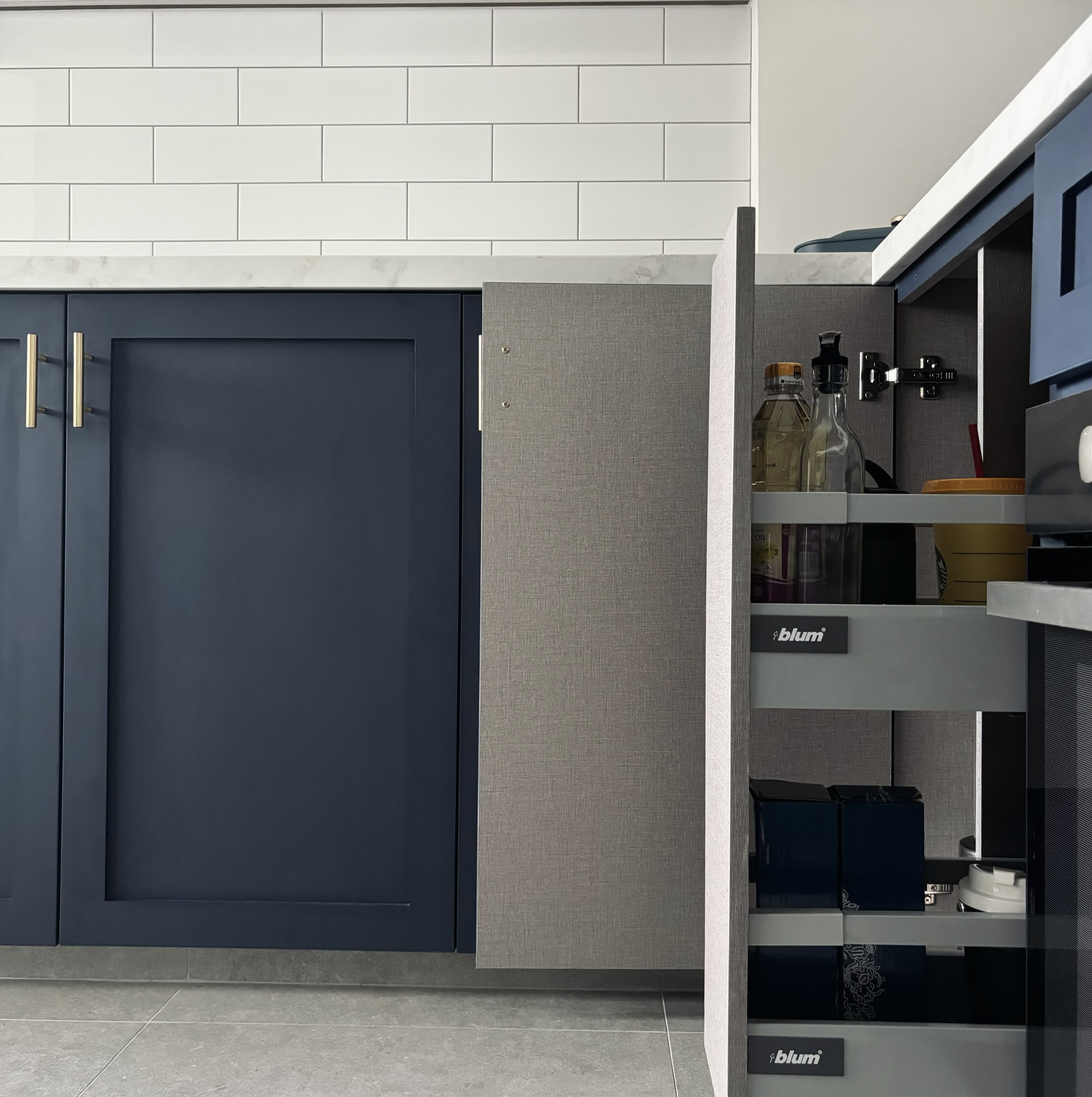 Our blue farmhouse style open concept kitchen!  - Dark blue kitchen cabinets, modern design, sleek handles, white subway