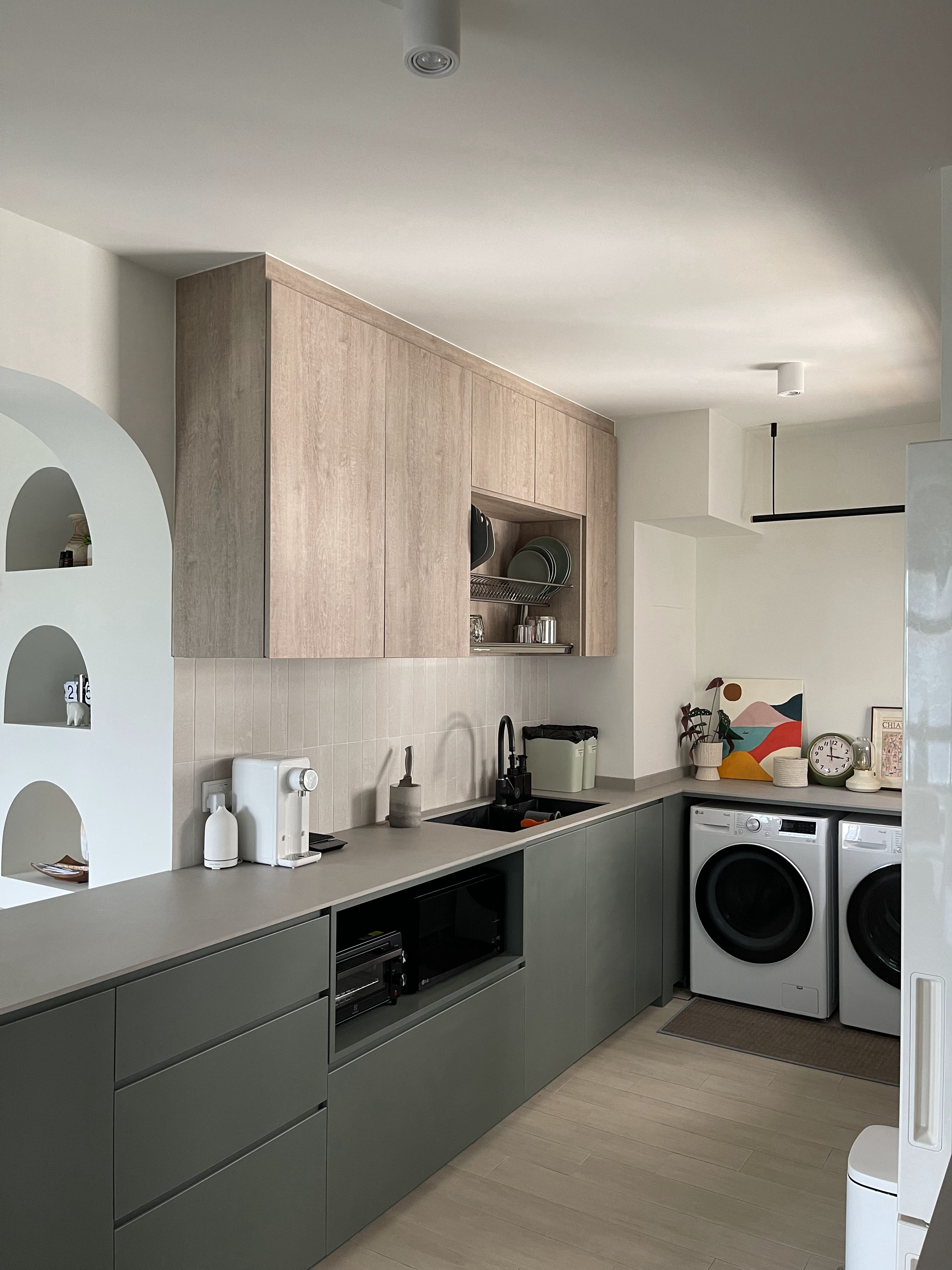 An Open-concept Galley Kitchen + Service Yard - Wooden cabinets, modern kitchen, gray countertops, built-in appliances, dual