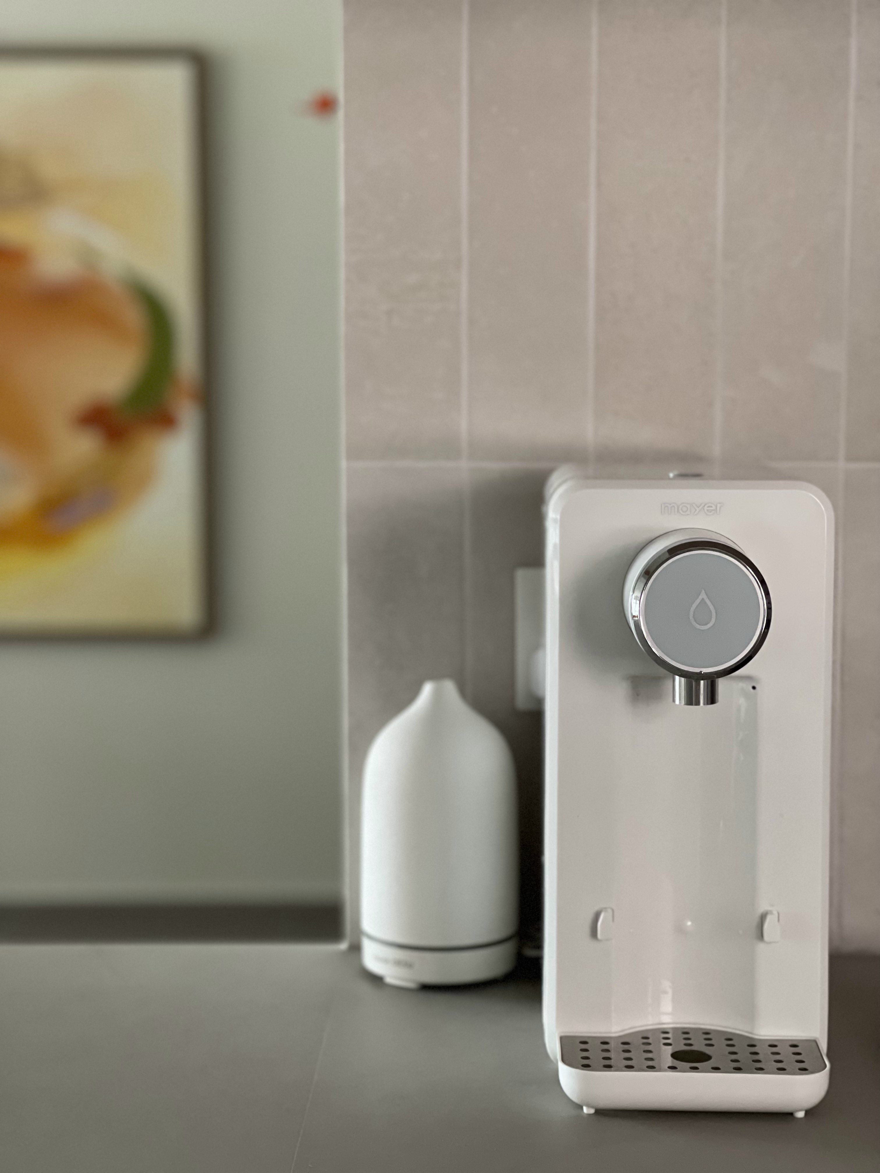 An Open-concept Galley Kitchen + Service Yard - smart water dispenser, modern kitchen, minimalist design, sleek white