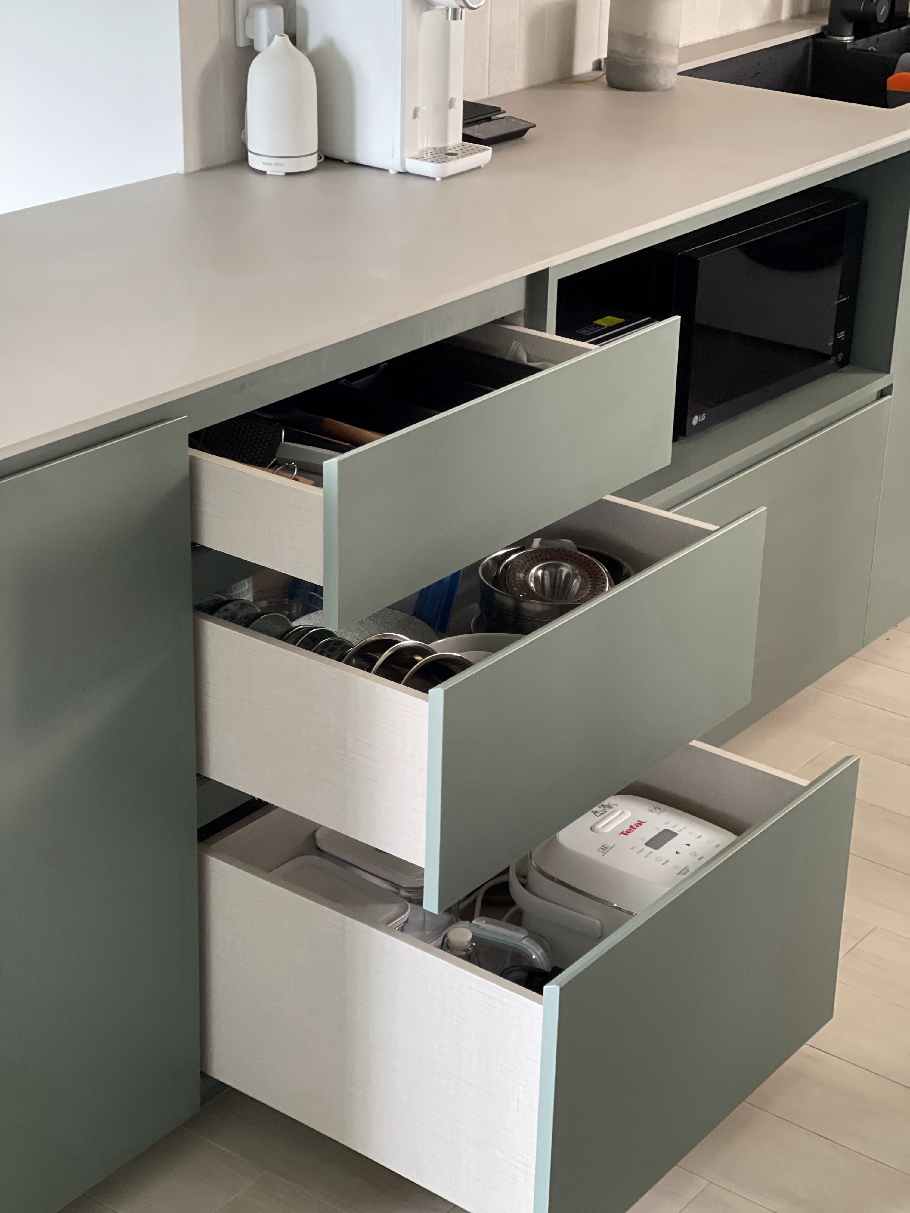 An Open-concept Galley Kitchen + Service Yard - Kitchen drawer, modern cabinets, open drawers, kitchen countertop, gray