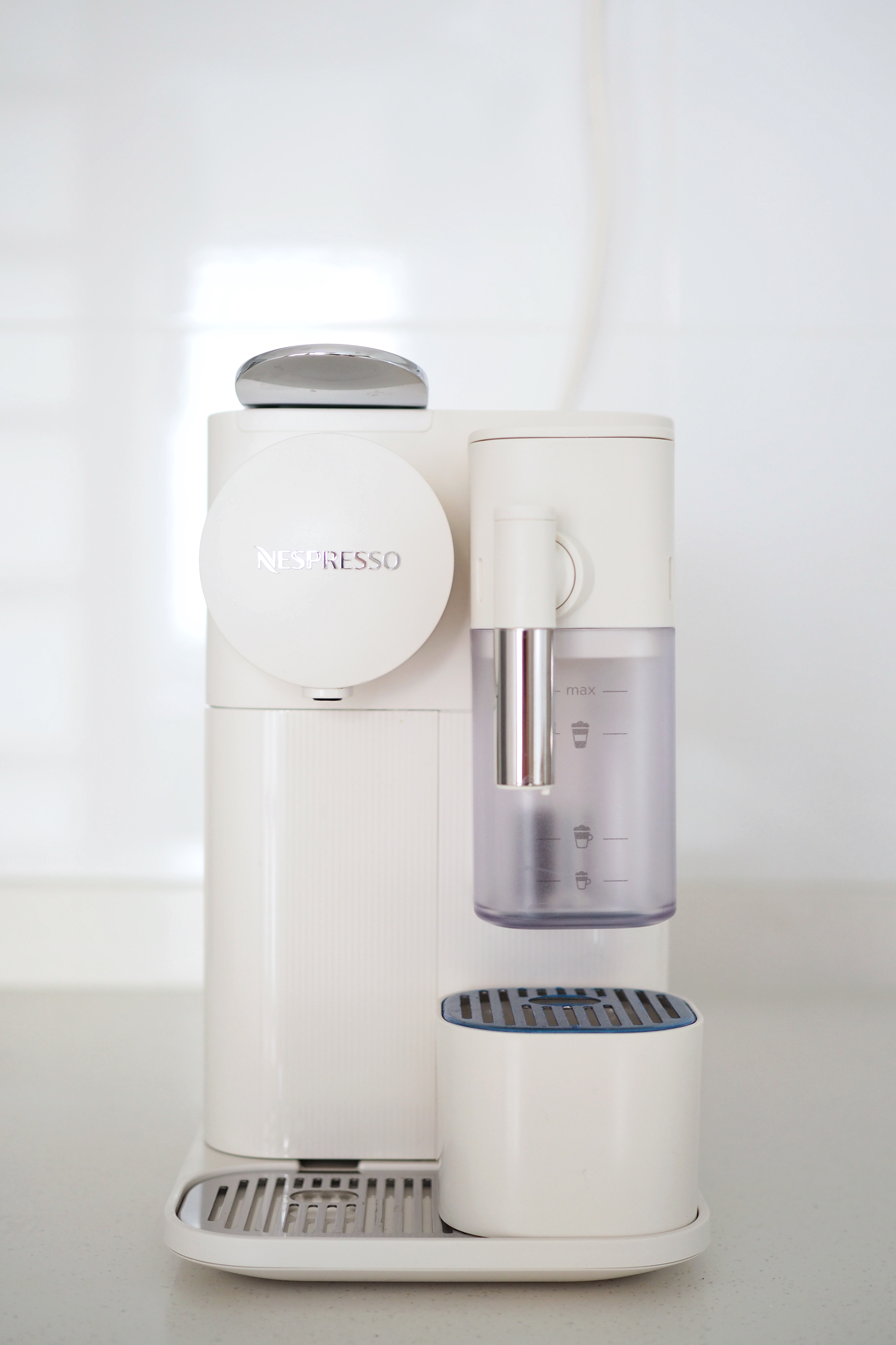 Home living: Coffee corner + delicious kopi - Nespresso coffee machine, modern design, sleek white color, transparent