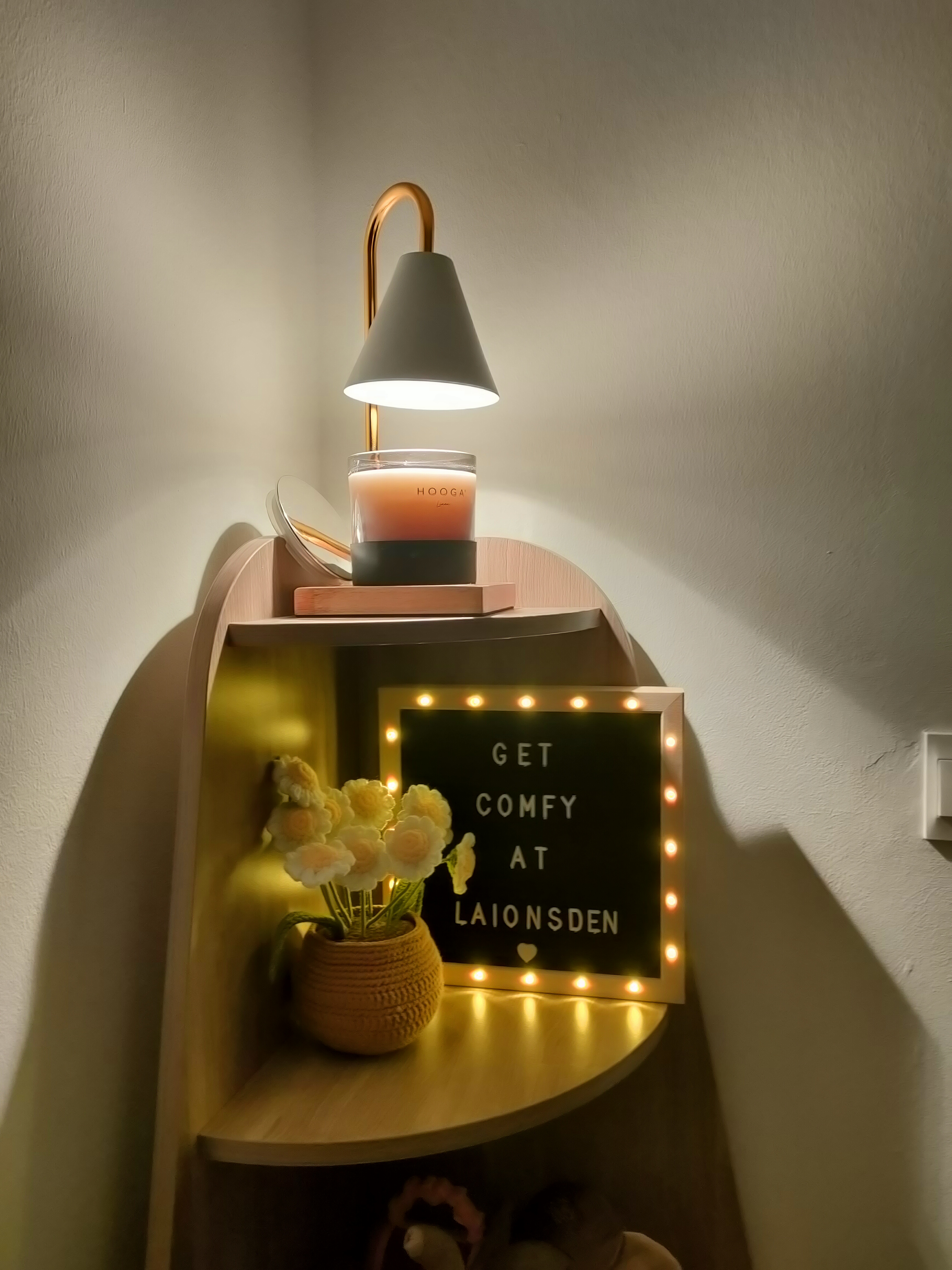 What makes the house our home... - Soft, warm lighting, minimalist decor, cozy ambiance, wooden shelf, modern lamp, candle