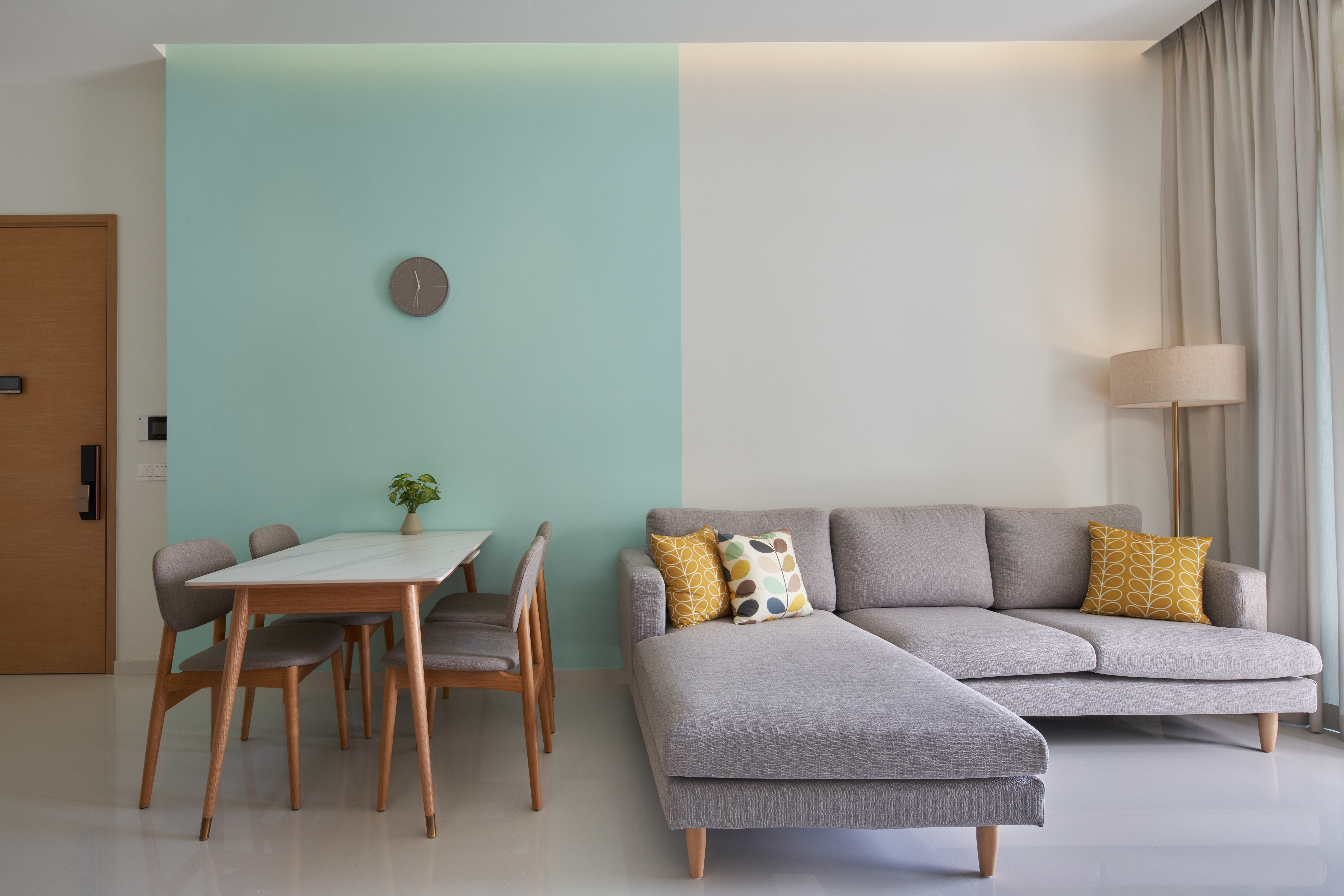 Crafting A Whimsical & Airy Home - Modern minimalist living room, light blue and white color scheme, dining area with wooden