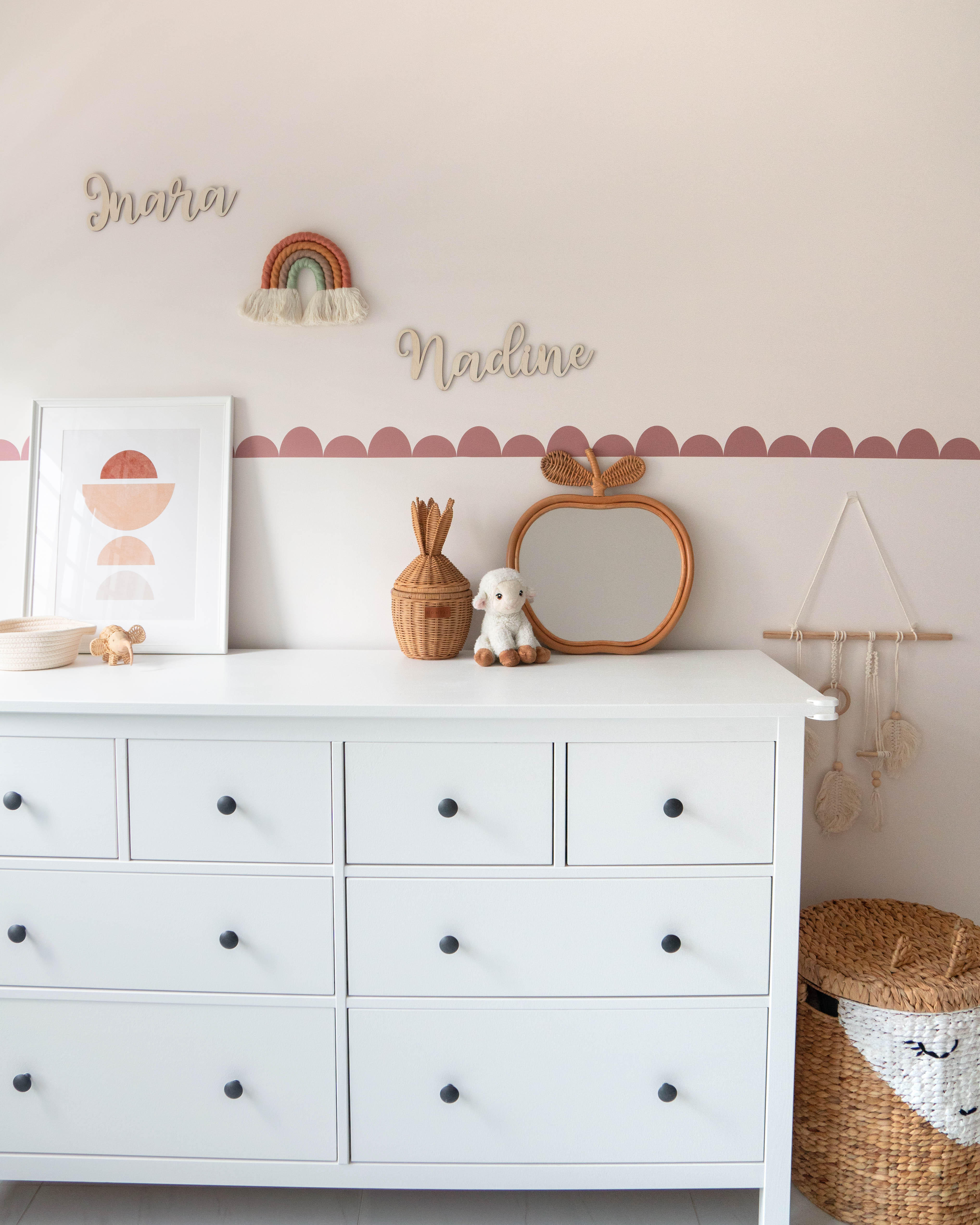 Gender Neutral Kids' Playroom + Girly Dress-Up Room - White dresser with black knobs, minimalist decor, pastel wall color