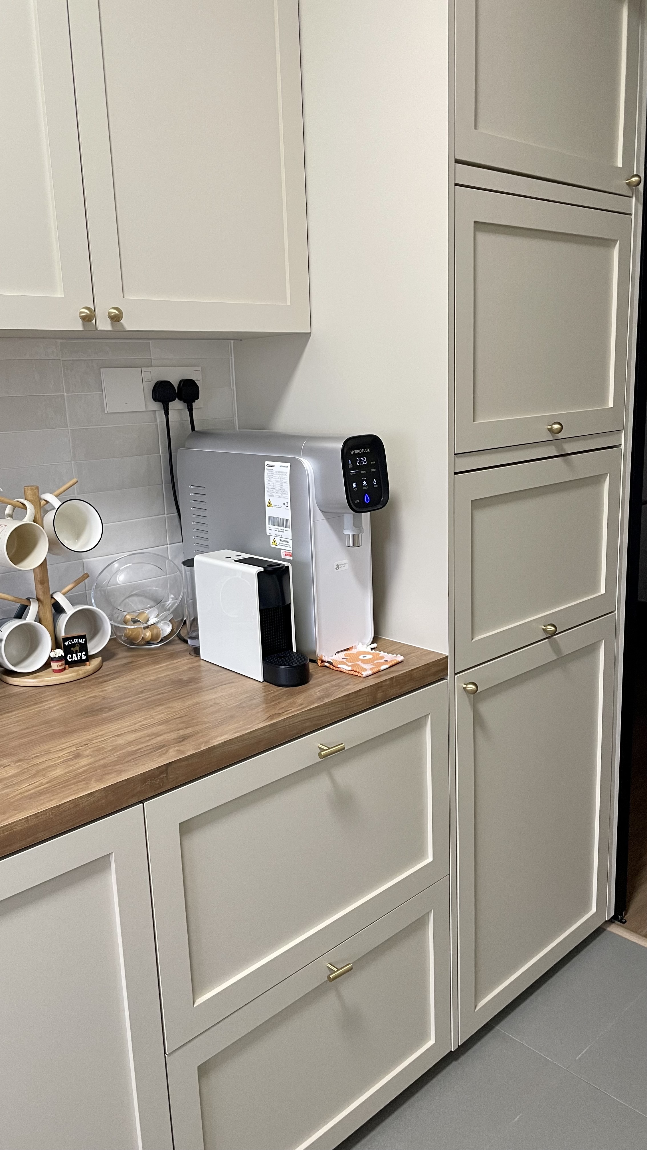 Storage solutions when there’s not enough drawers - kitchen countertop, white cabinets, modern design, wooden surface, coffee