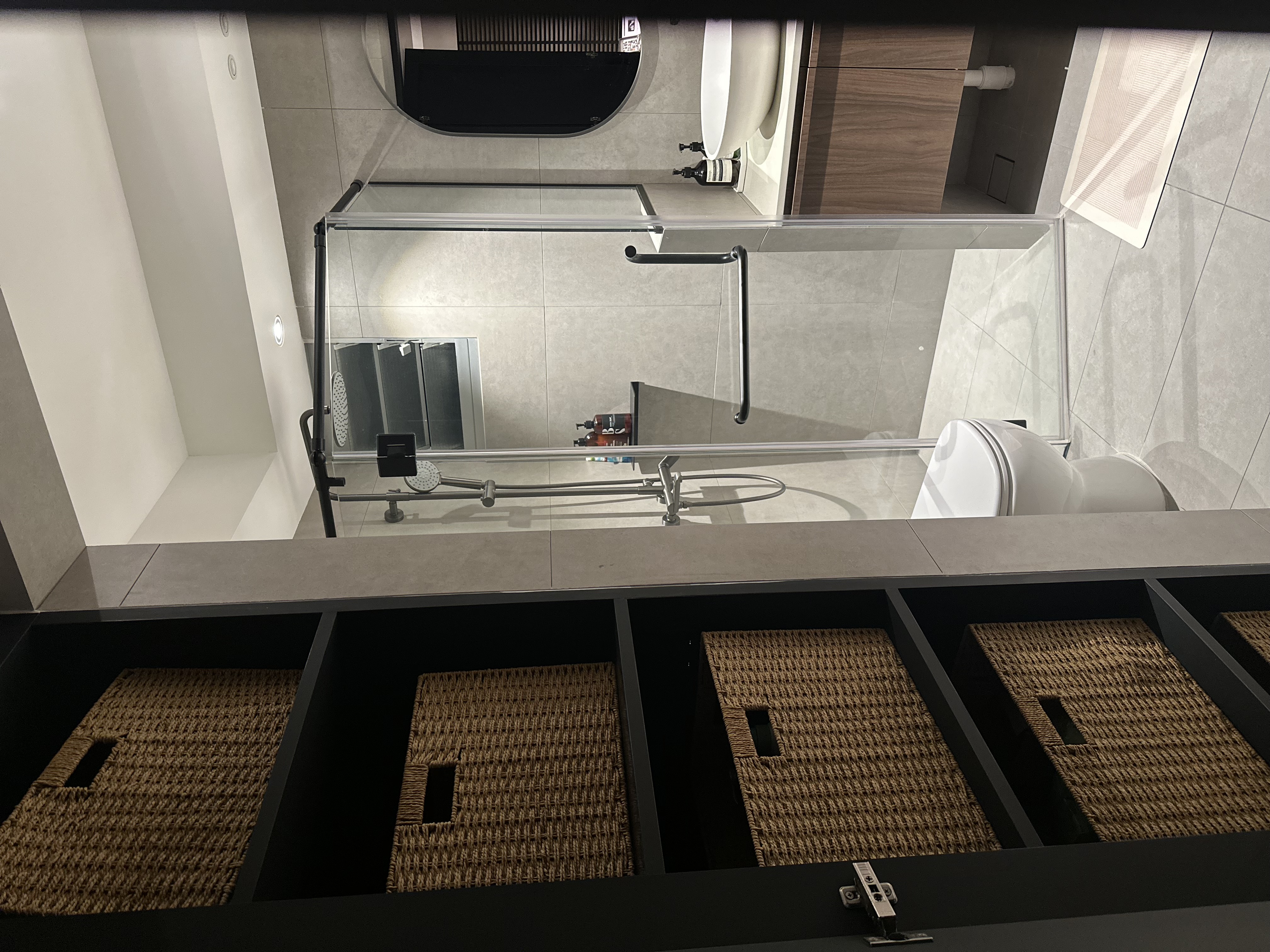 Our hidden common bathroom  - modern bathroom, sleek design, minimalist decor, contemporary fixtures, glass shower enclosure