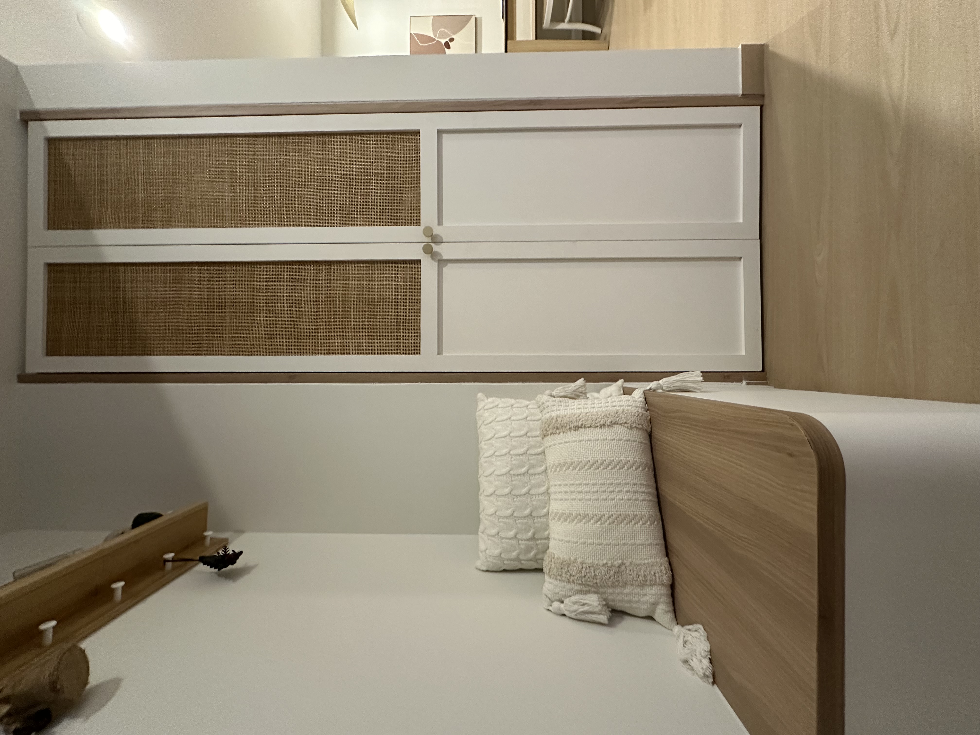 Entryway - The first impression of our home - White wooden dresser with woven mesh panel, minimalist design, soft lighting