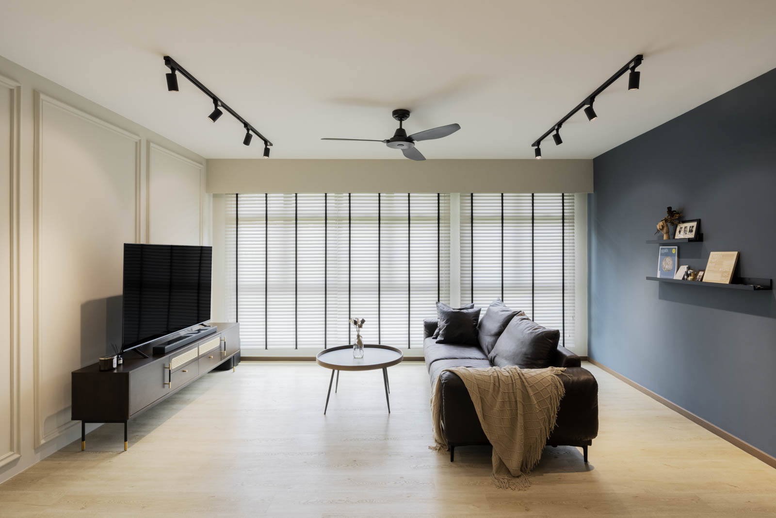 Creating A Modern Country Retreat - Modern living room with large flat-screen TV, dark brown entertainment center