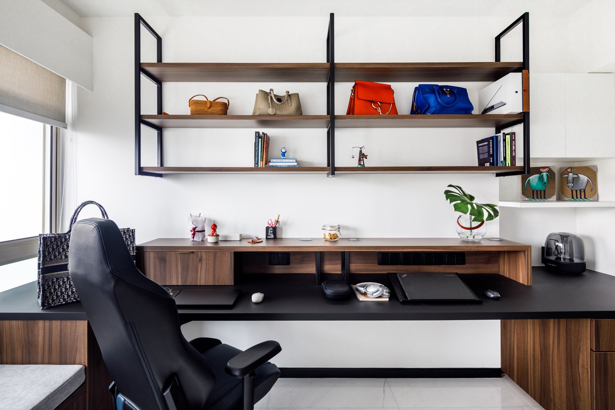 A Minimalist & Industrial Look For A Young Couple - Modern workspace with sleek black desk, ergonomic black office chair