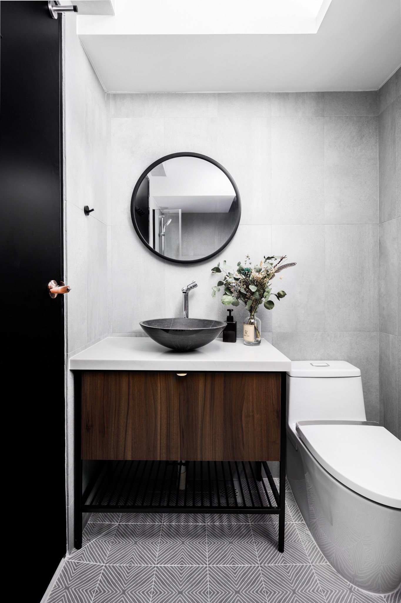 A Minimalist & Industrial Look For A Young Couple - modern bathroom, minimalist design, sleek vanity, round mirror, floating