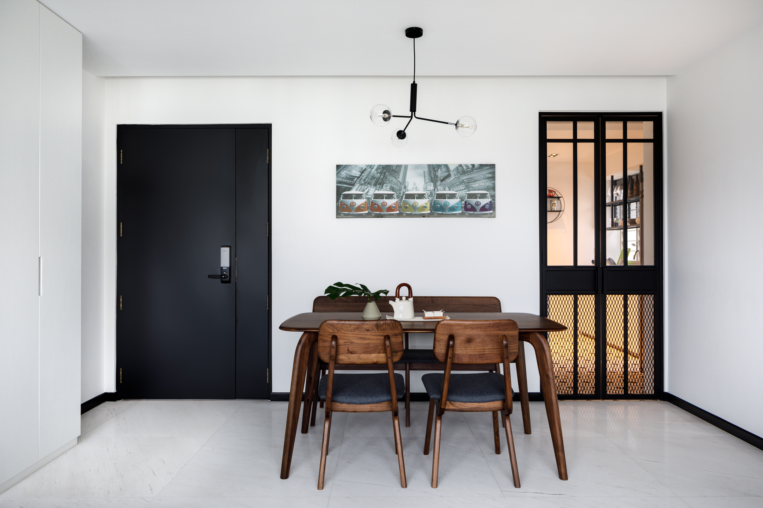 A Minimalist & Industrial Look For A Young Couple - Modern minimalist dining room, sleek black door, contemporary furniture