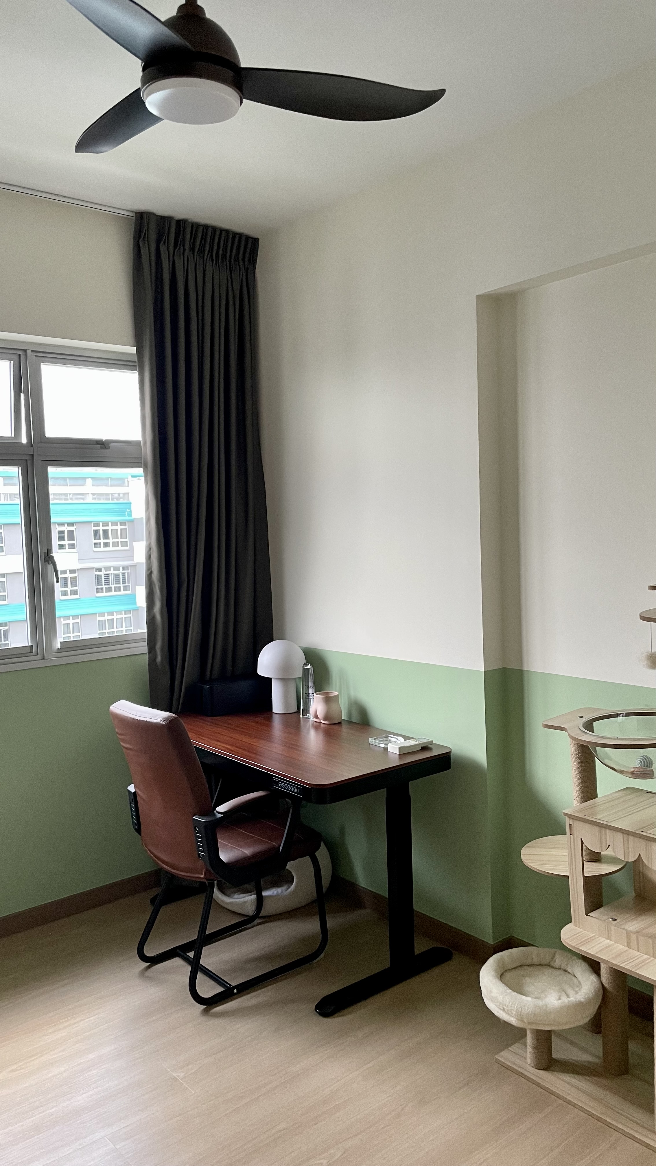 Don’t turn on the big lights 💡 - Office space with ergonomic chair, desk, and pendant light, natural light from window