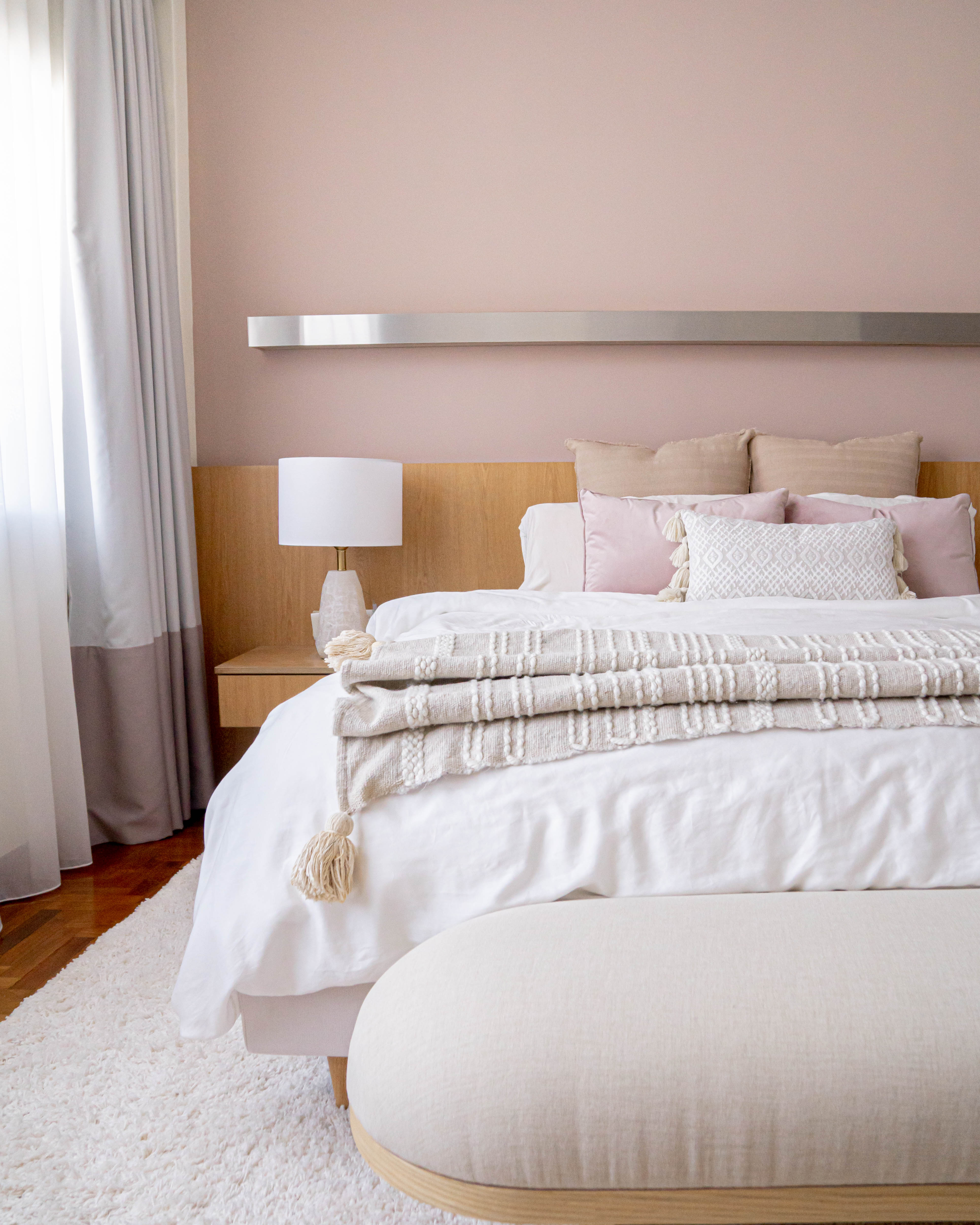 Cosy Luxurious Master Bedroom Transformation - Soft, pastel-colored bedding, white and beige pillows, fluffy throw blanket