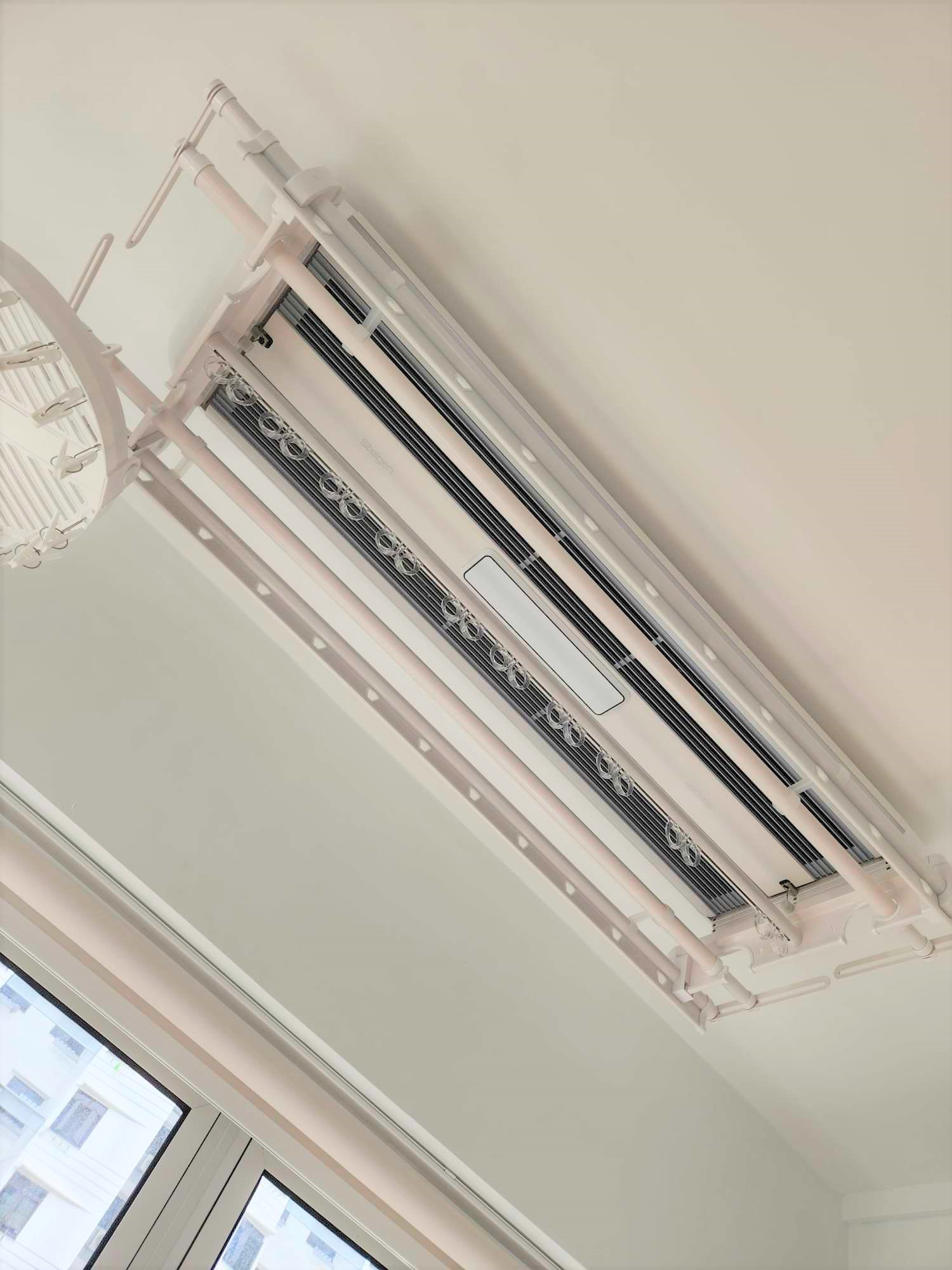 Our laundry space  - Air conditioner unit, ceiling-mounted, white color, modern design, dual fan, ventilation system, metal