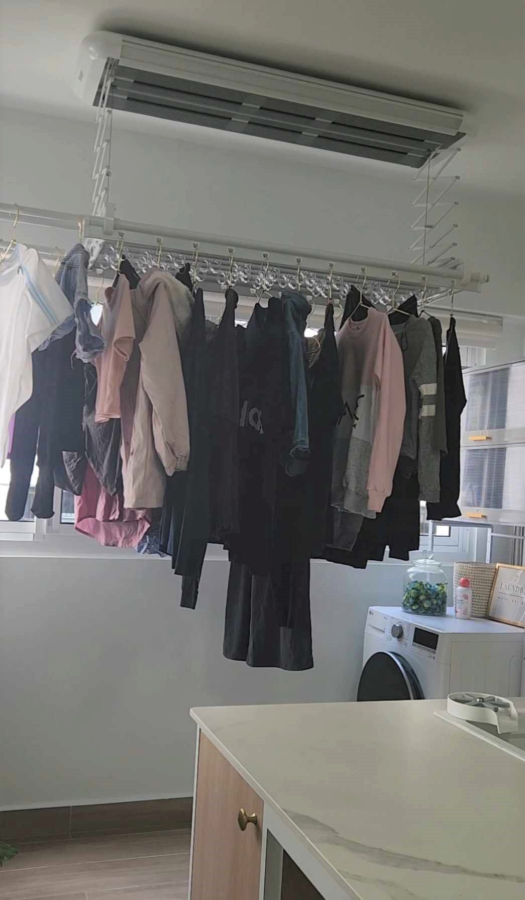 Our laundry space  - Dresser, hanging clothes, laundry room, white walls, modern design, indoor setting, clothes rack