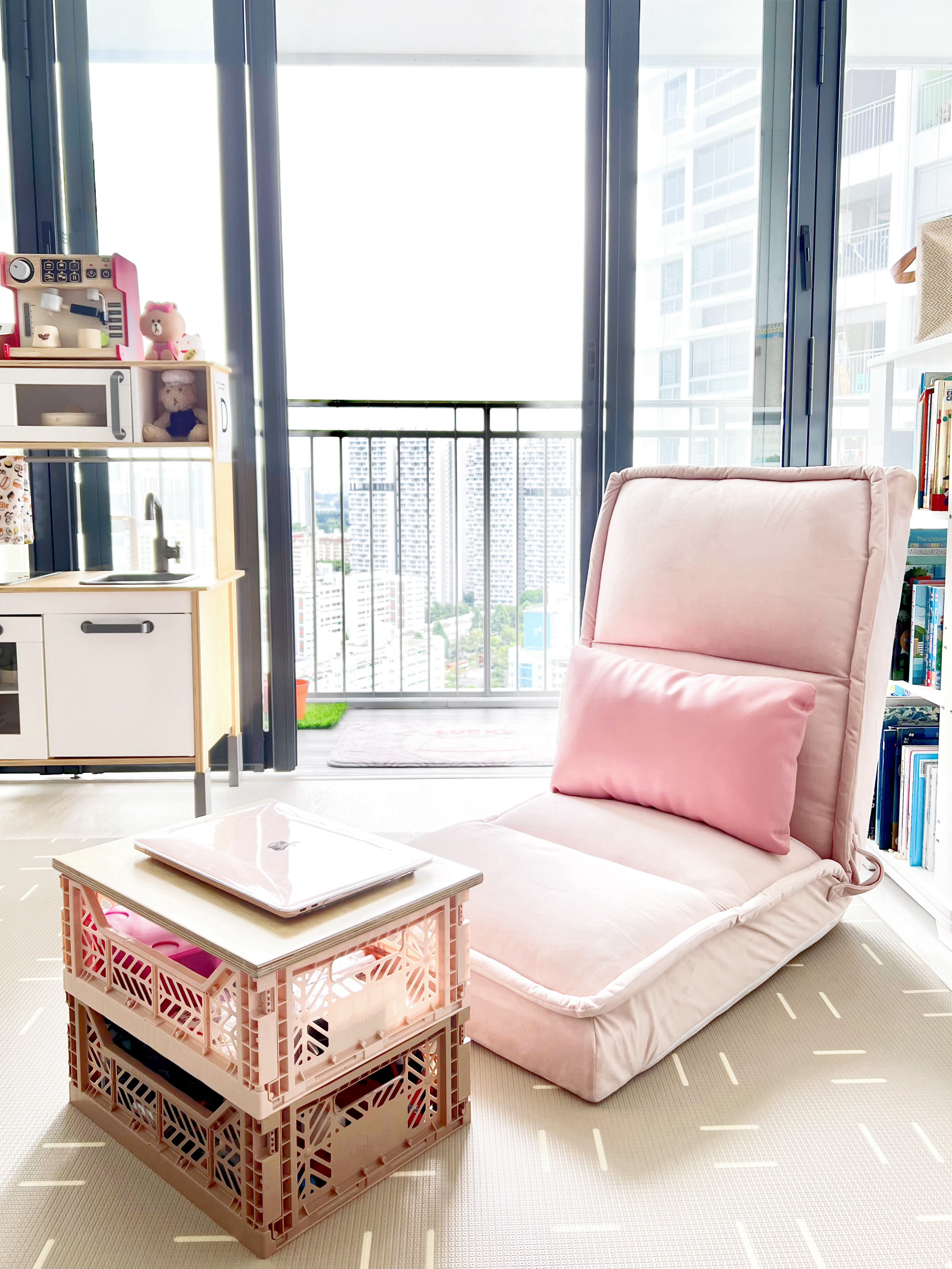 Create Cosy Corners Everywhere! - Pink cushioned chair, pink pillow, modern living room, large window, city view, indoor