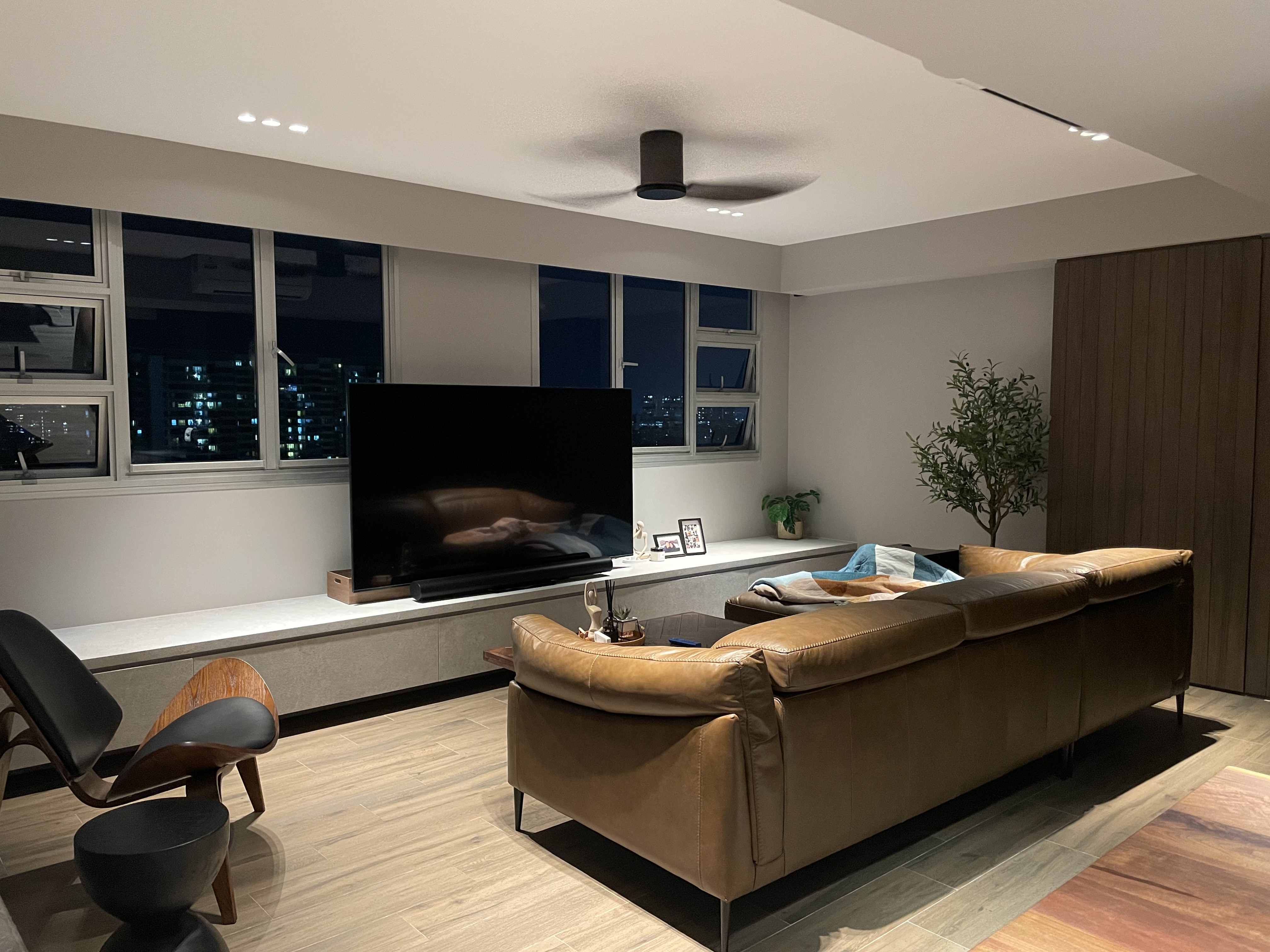 ✨Glowing up our home with these ✨ - Modern living room, sleek furniture, contemporary design, large window, cityscape view