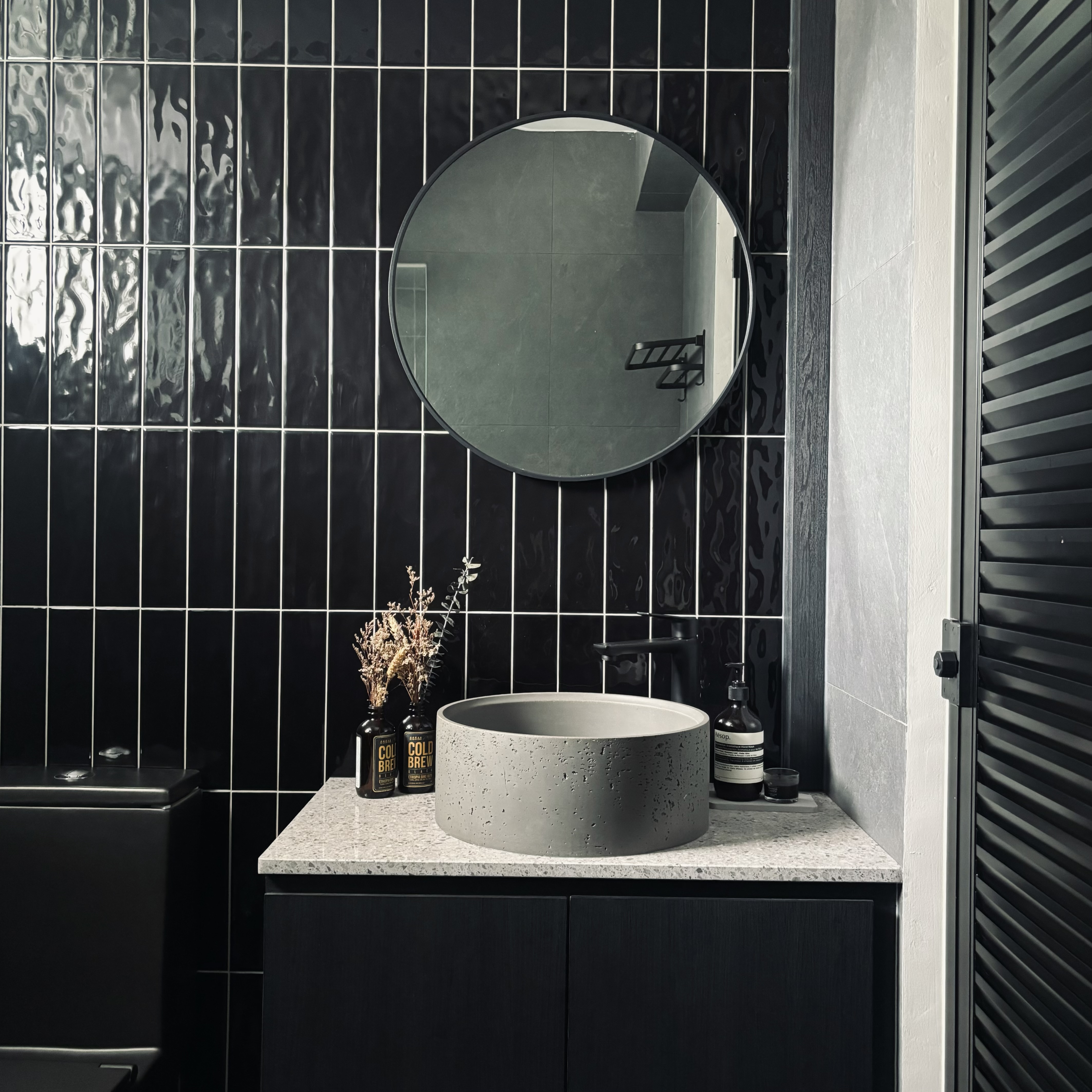 Two toilets, two different themes ✨ - Modern bathroom vanity, sleek design, black and white color scheme, circular mirror