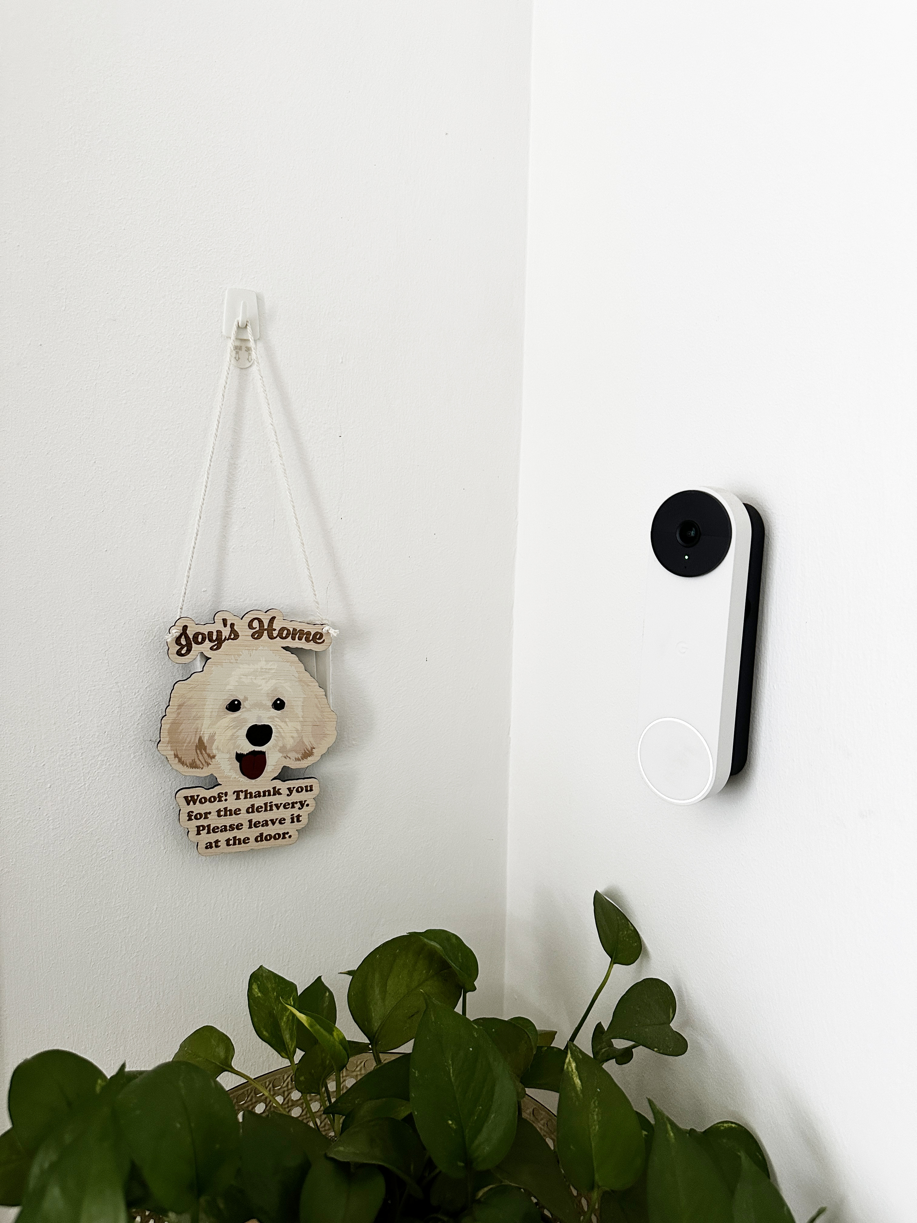 Our entryway with ample storage space - Dog-shaped sign with "Joy's Home" and "Woof! Thank you for the delivery Please leave