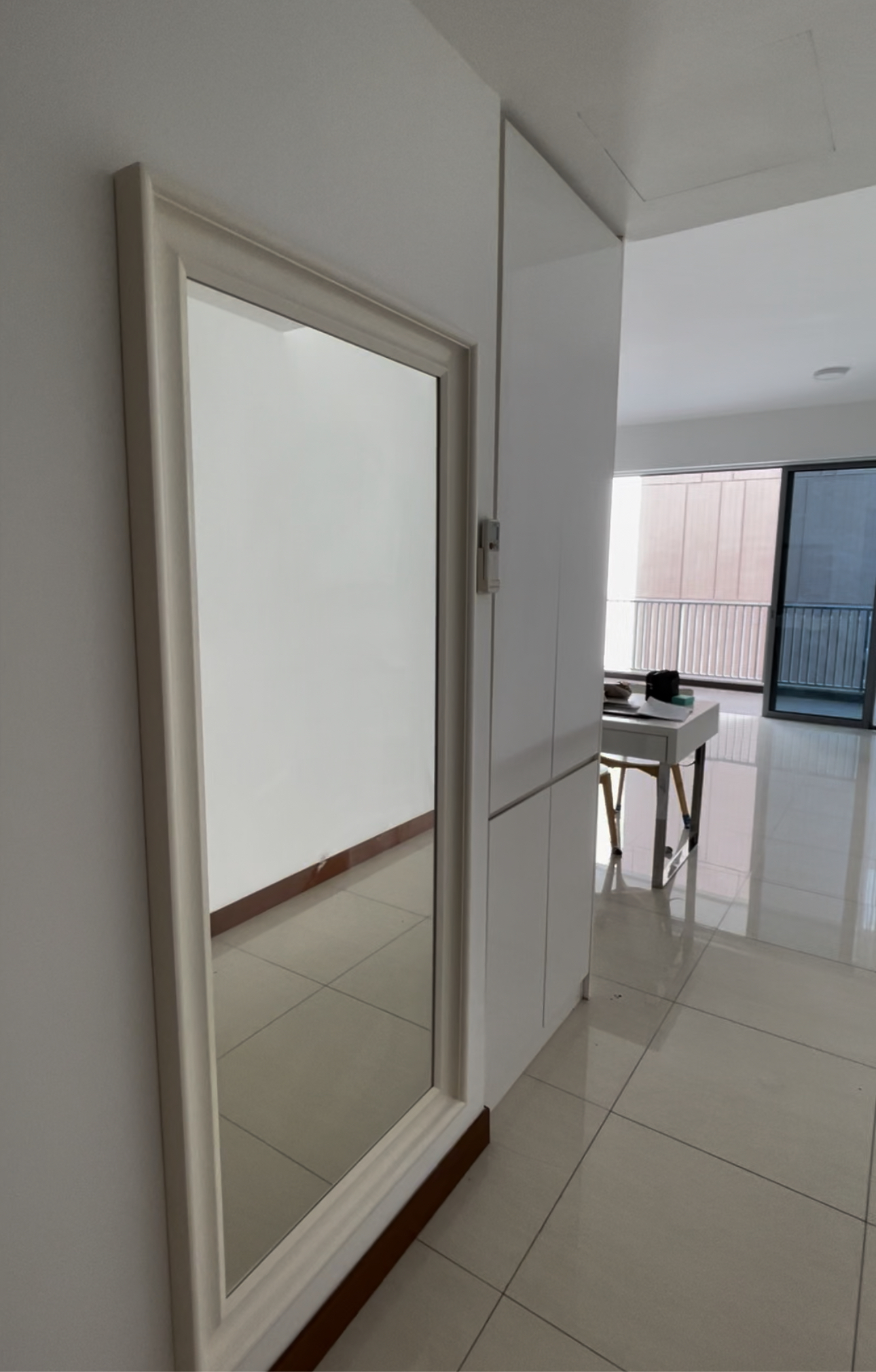 Our entryway with ample storage space - Mirror, white walls, tiled floor, room with large window, furniture, table, black