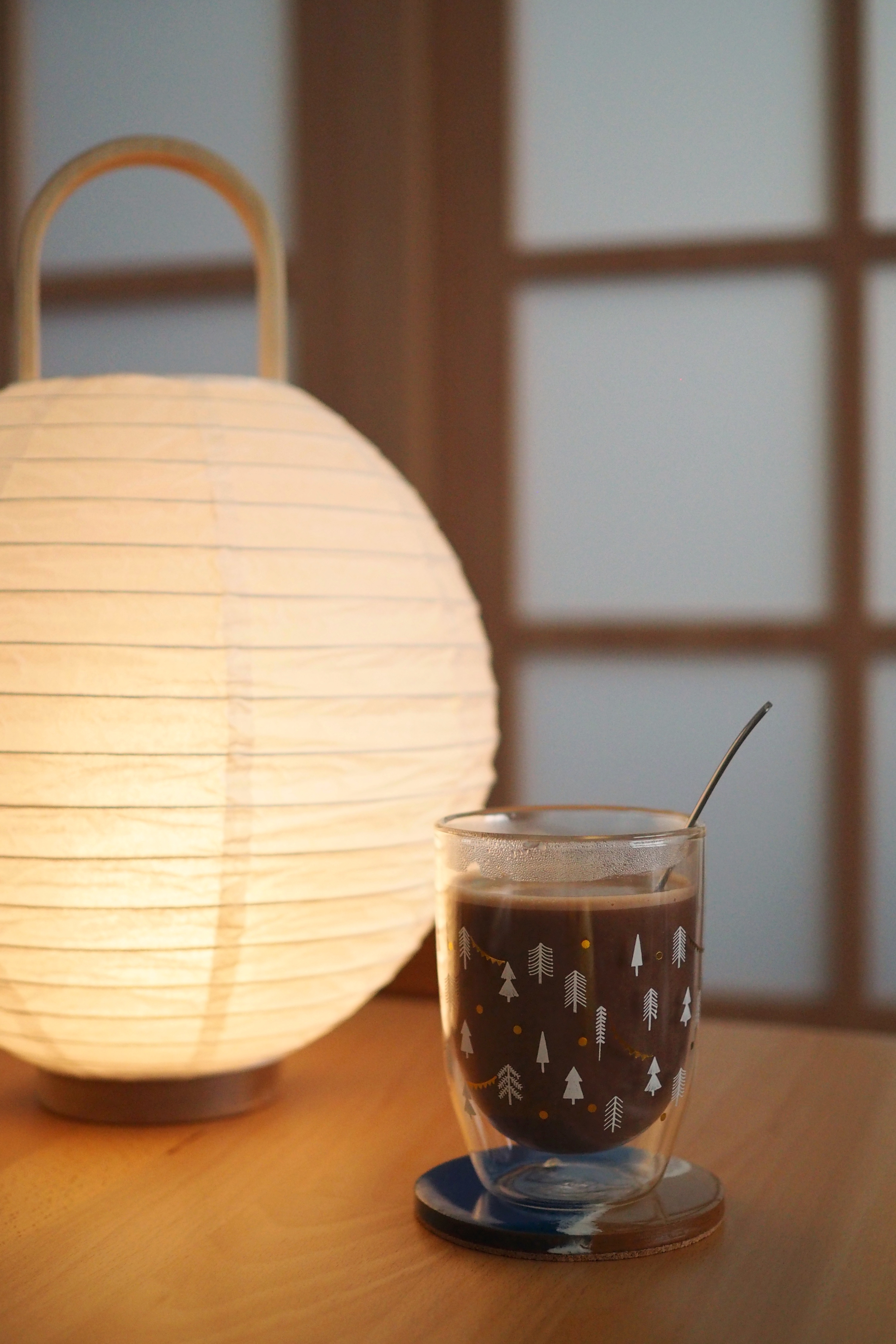 All things we are proud of in our home! - Soft, warm glow from traditional lantern, cozy indoor setting, wooden table, clear