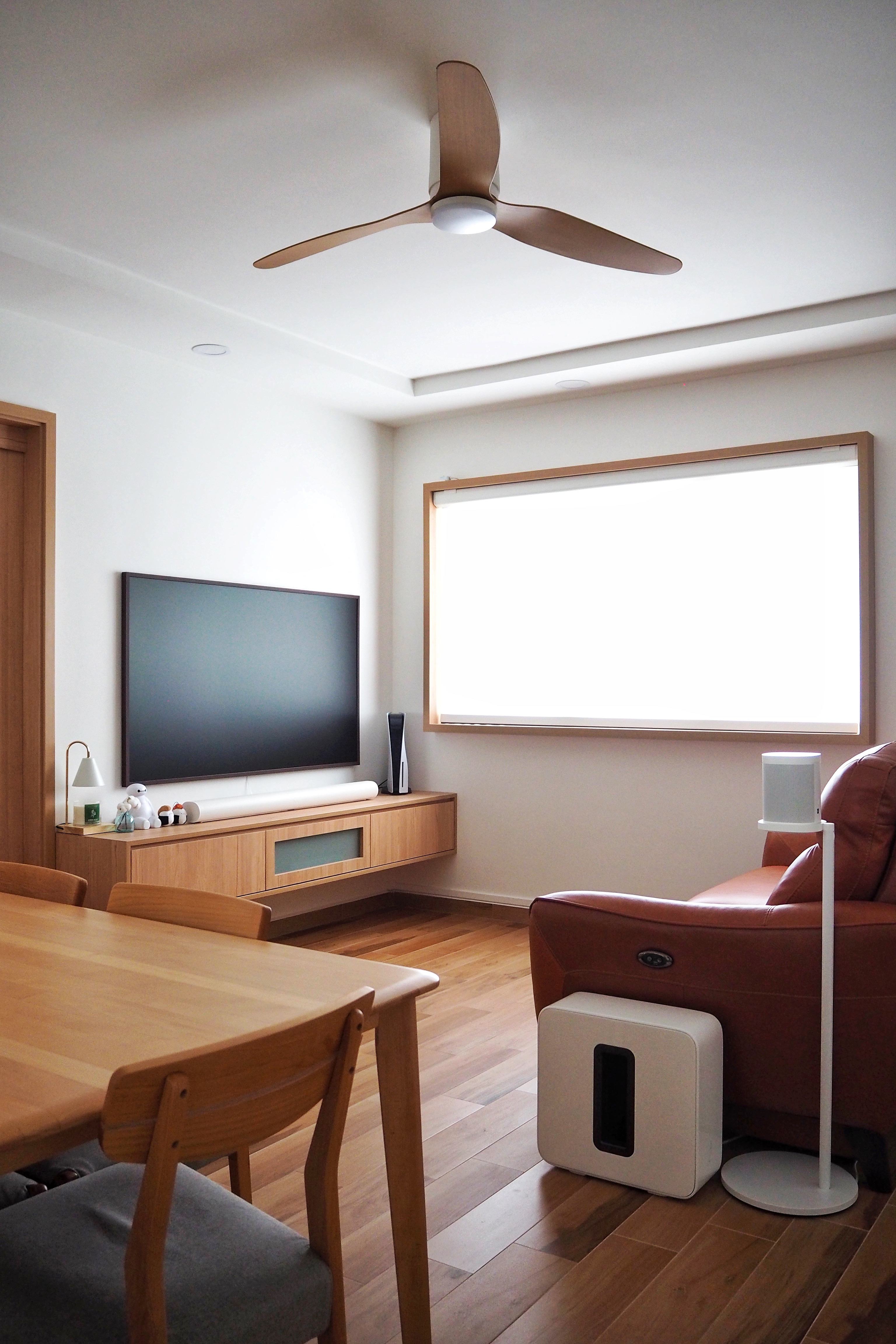 All things we are proud of in our home! - Modern living room with wooden furniture, large flat-screen TV on a wooden cabinet
