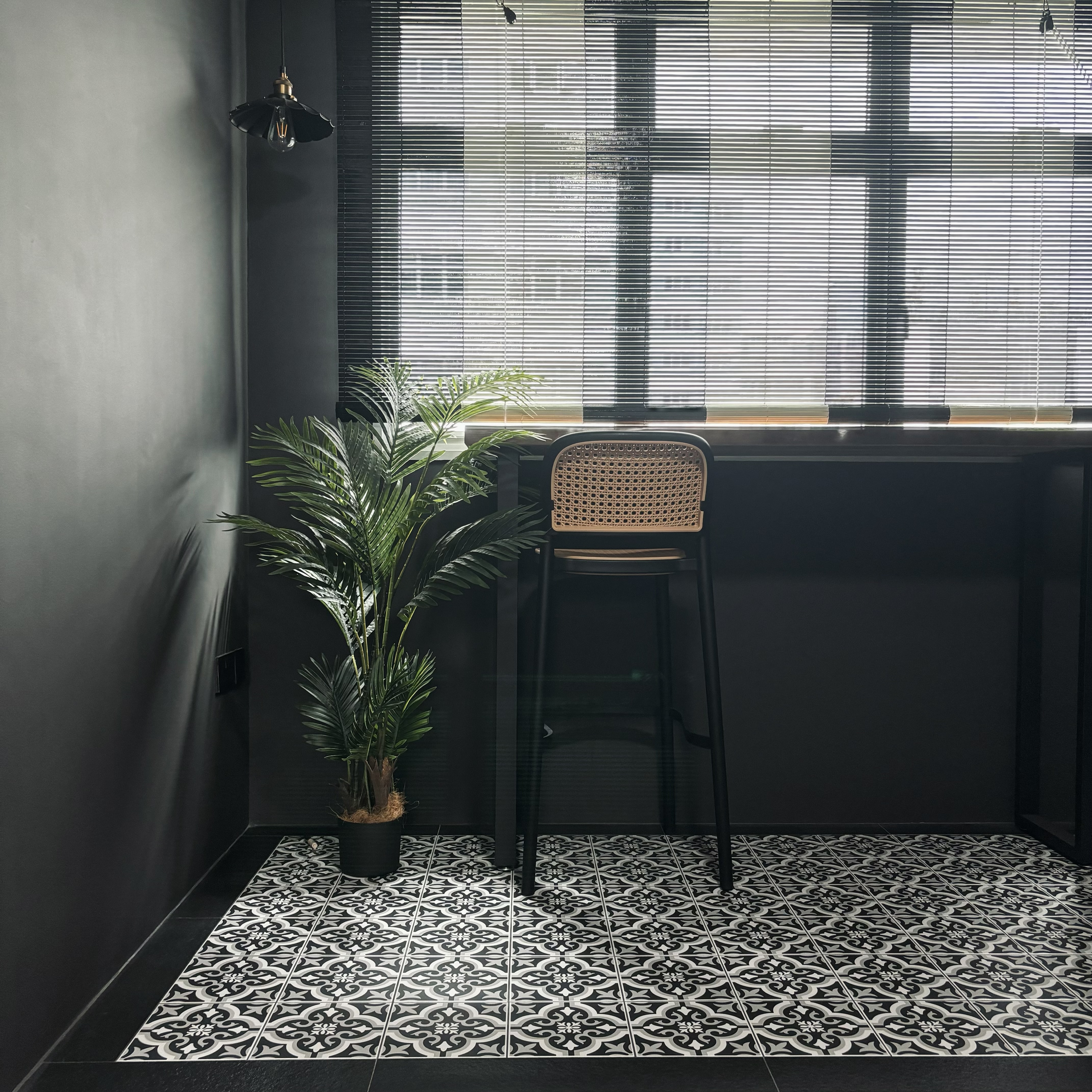 Our version of recreational area - the "balcony" - Modern minimalist interior, black and white patterned tiles, sleek black