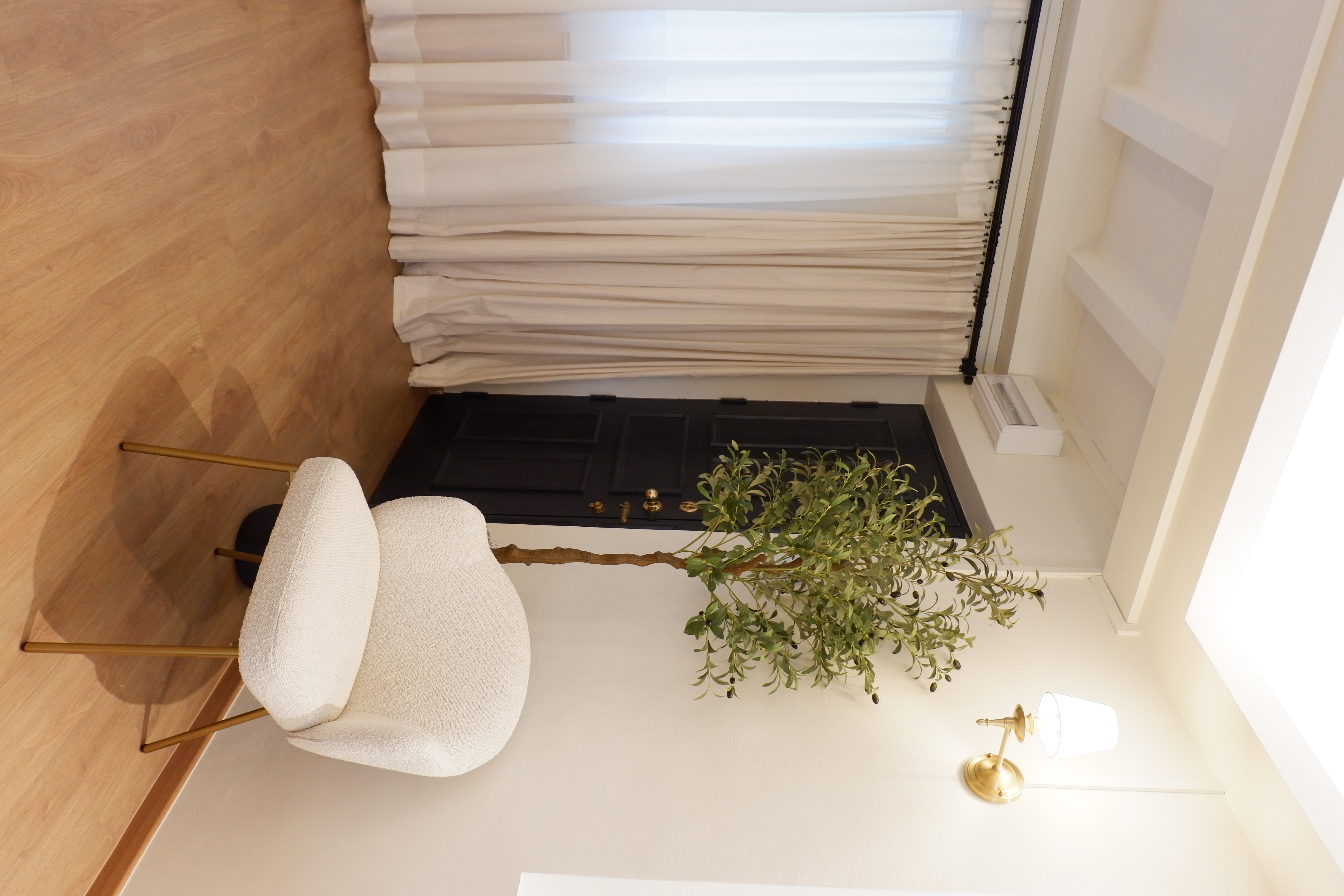 Styling Our Entryway for a Warm Welcome - modern minimalist interior, cozy seating area, white chair with gold legs, wooden