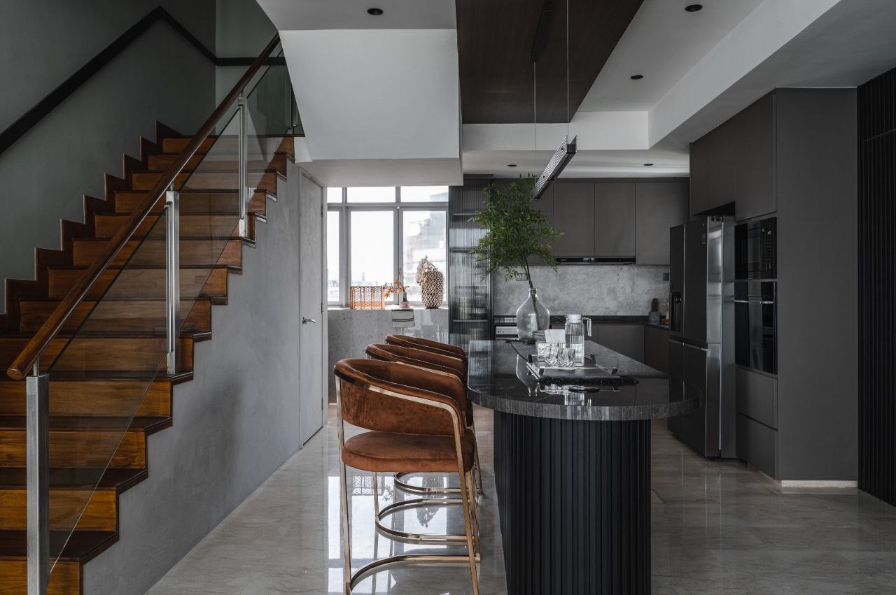 Bright and Airy Modern Home - Modern kitchen with sleek design, spacious layout, dark cabinetry, large island with granite