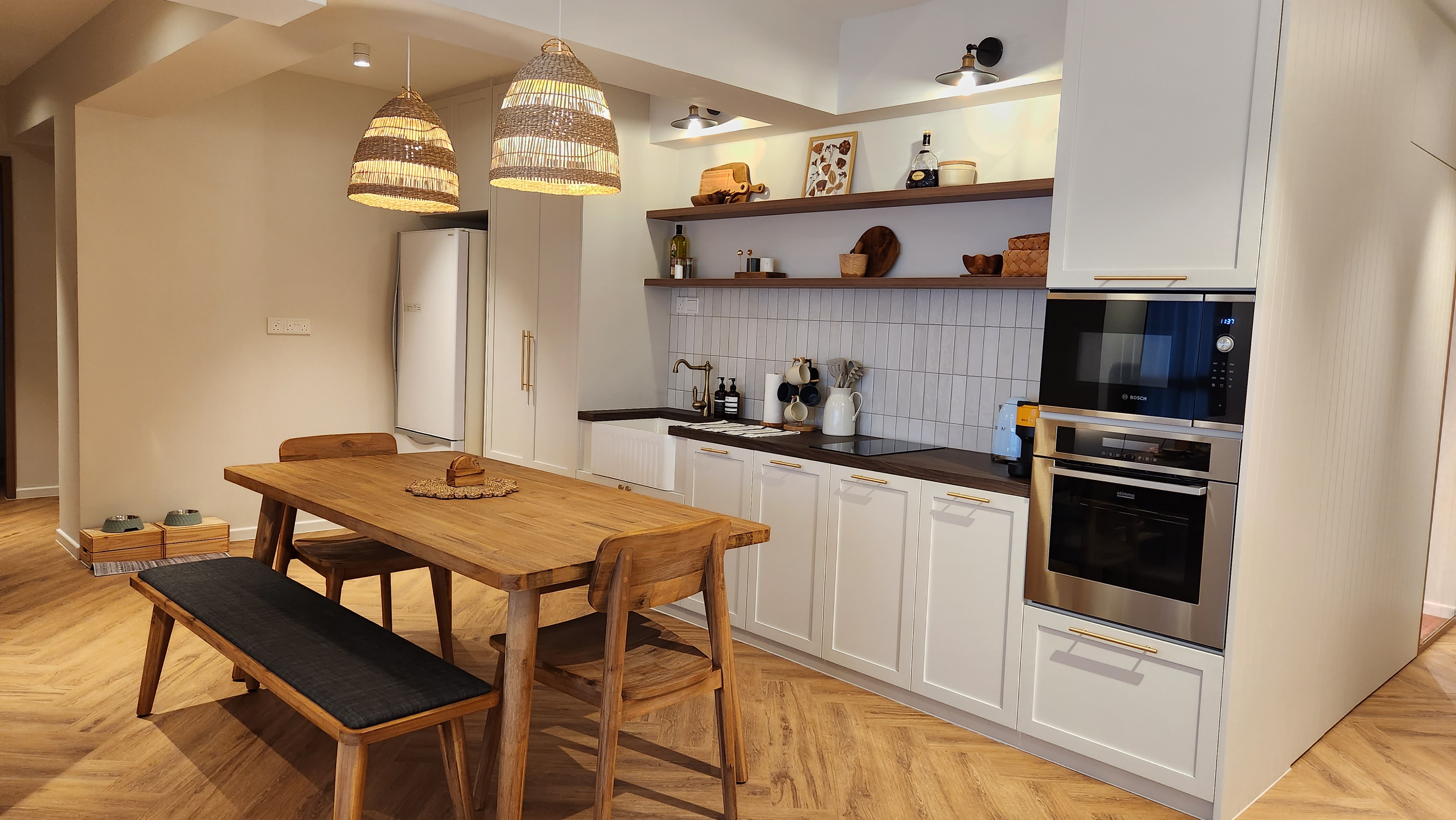 Modern Farmhouse with a Rustic touch in Bidadari - Wooden dining table with black cushion, white cabinets, modern kitchen