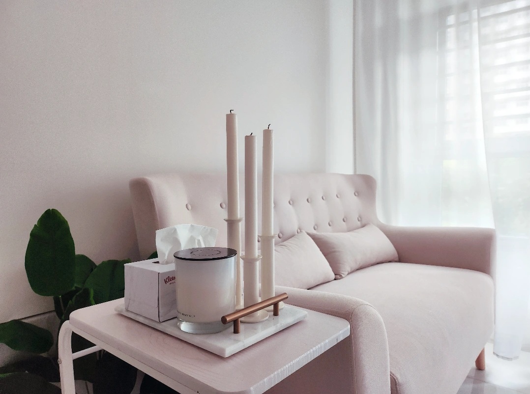 Living room & bedroom are our comfy nooks! - Candles, minimalist, cozy, soft lighting, pastel sofa, tufted upholstery, white