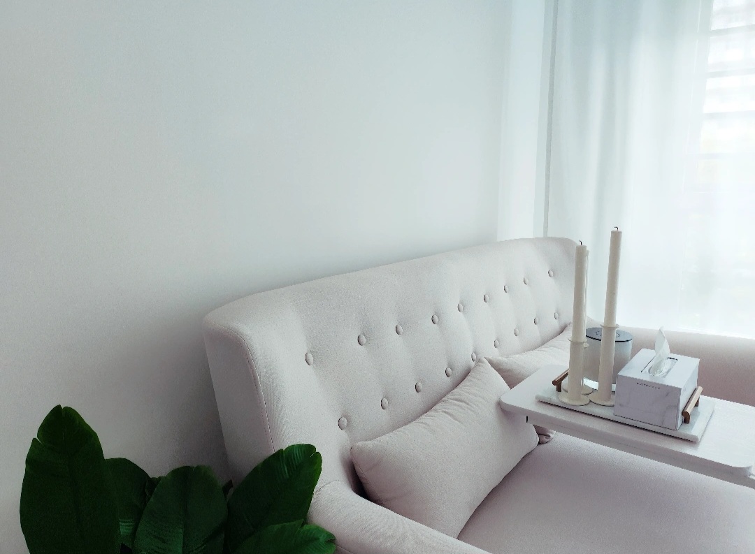 Living room & bedroom are our comfy nooks! - White tufted sofa, minimalist decor, soft lighting, pastel color palette, cozy