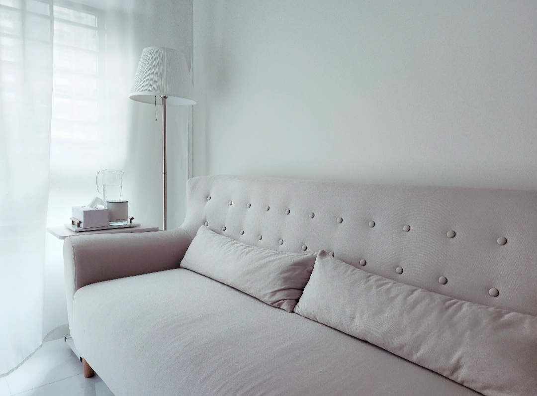 Living room & bedroom are our comfy nooks! - White tufted sofa, minimalist decor, soft lighting, pastel color palette, cozy