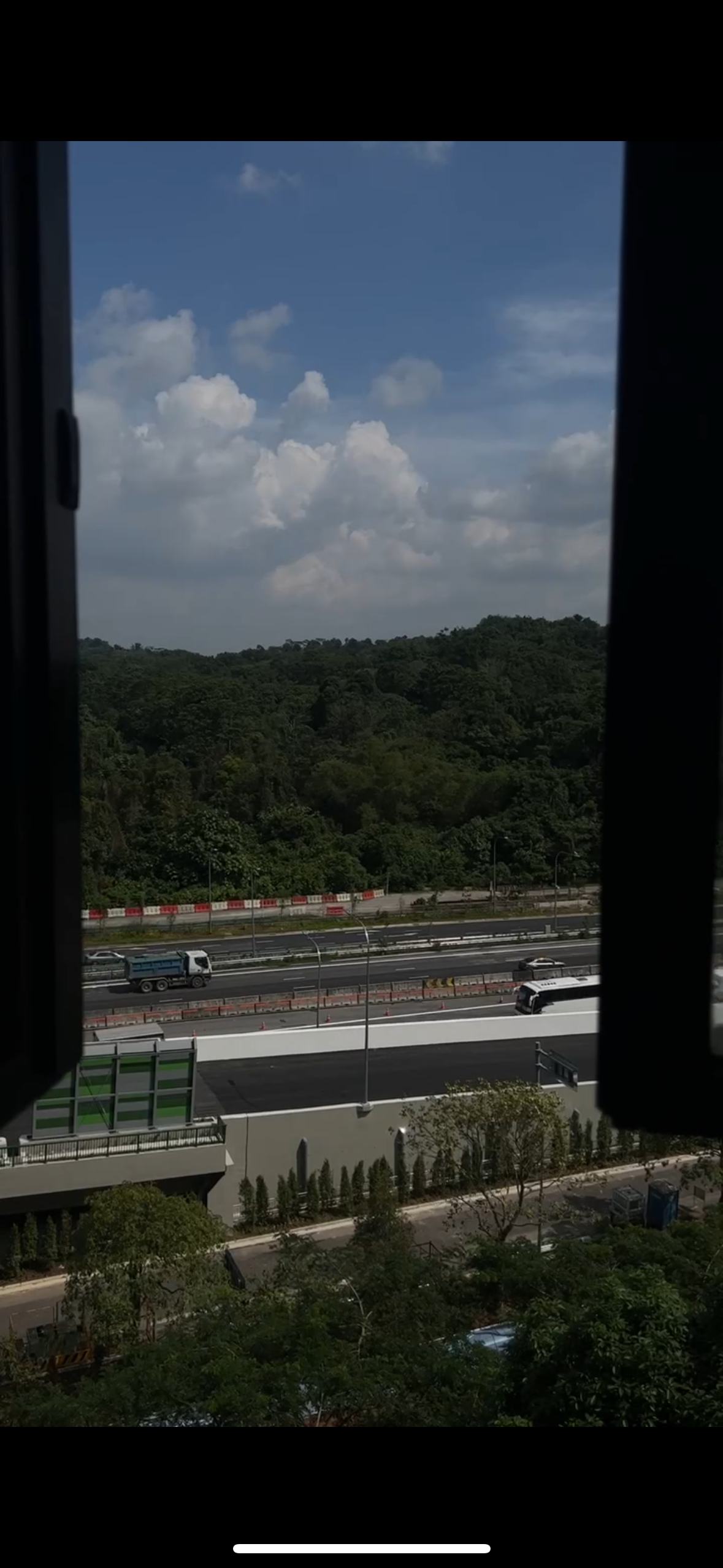 Embracing Tranquility Journey Through Our Personal Haven - vibrant green forest, clear blue sky, fluffy white clouds, urban