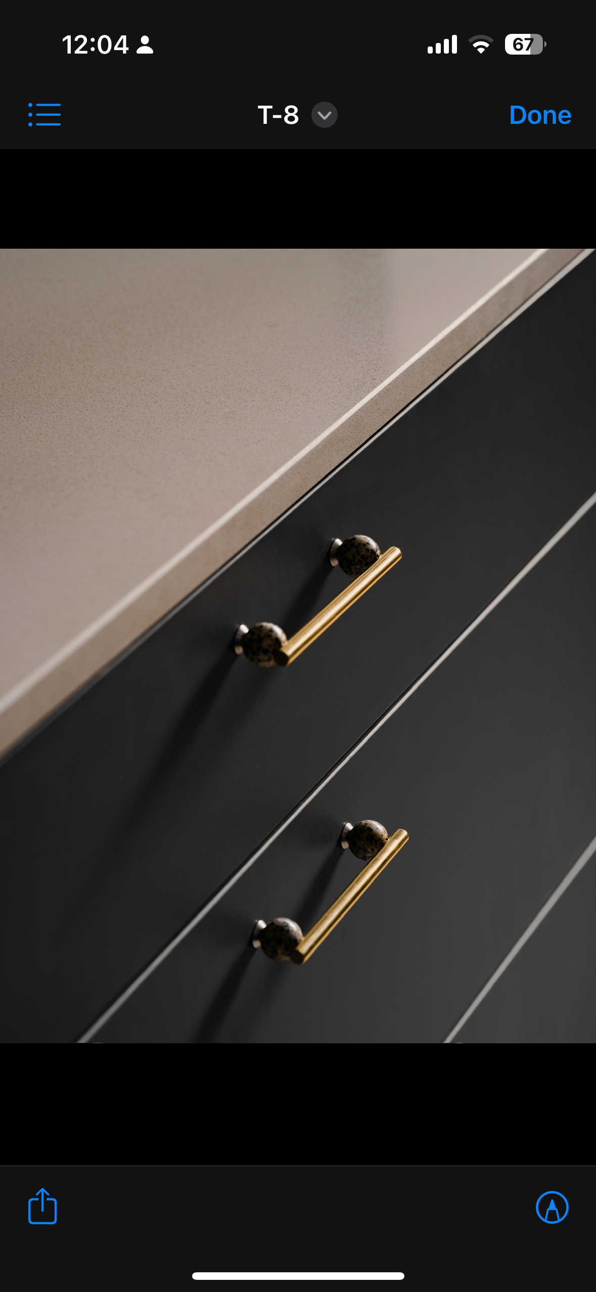 A mid-century modern home in the East - Kitchen countertop, modern cabinet, gold handles, sleek design, minimalist kitchen