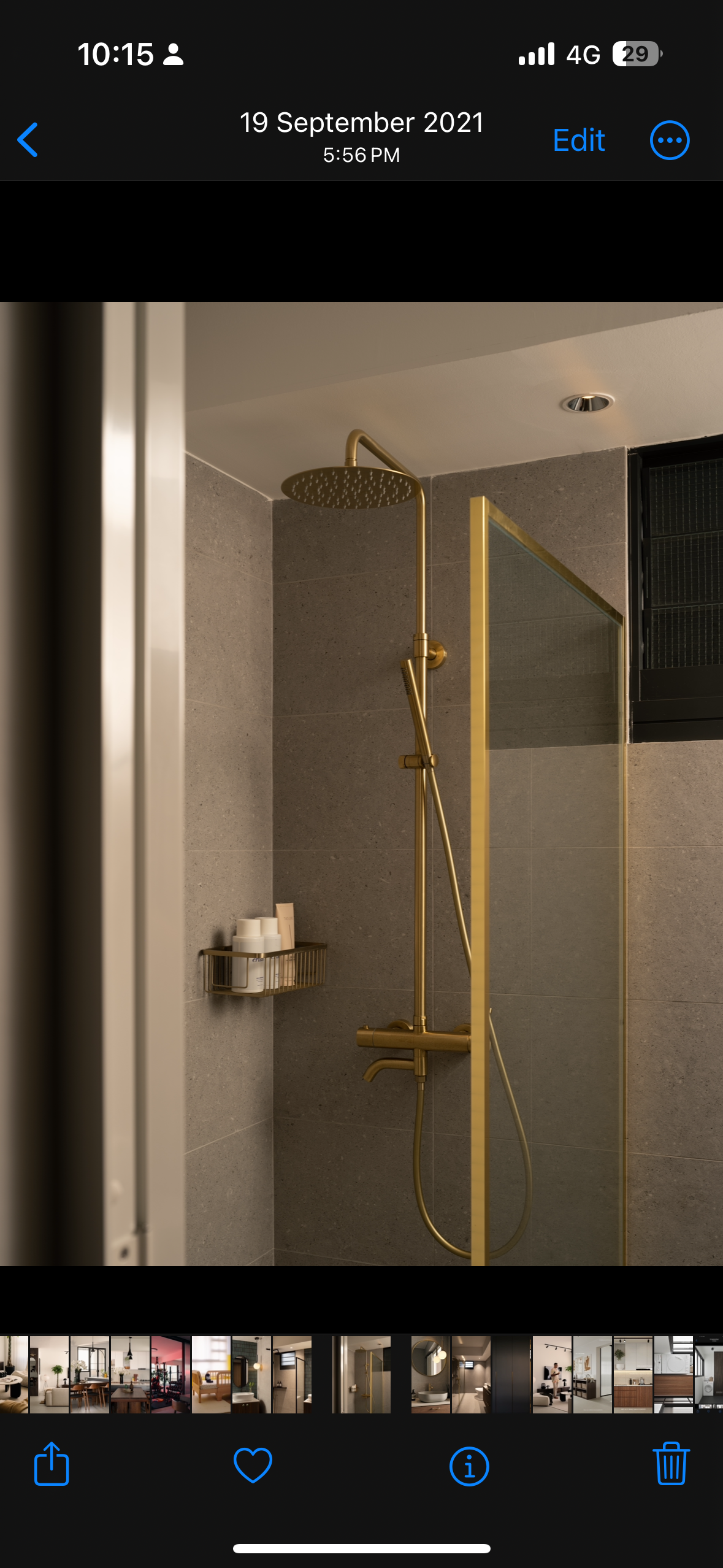 A mid-century modern home in the East - Modern bathroom interior with sleek fixtures, Elegant gold shower head and glass