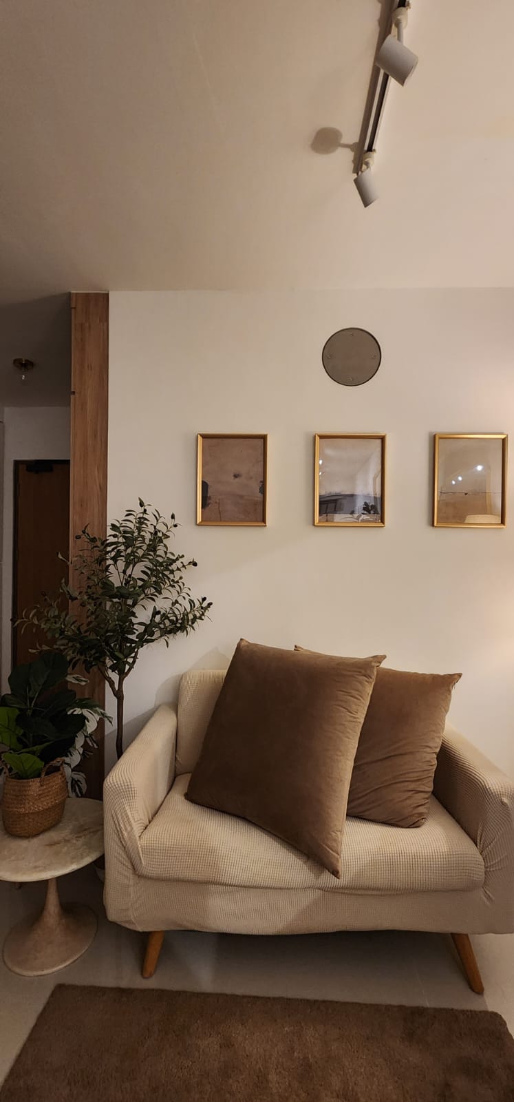 How to Hygge, Hoo Guh your life?! - Cream sofa, brown pillows, beige textured upholstery, wooden legs, round side table