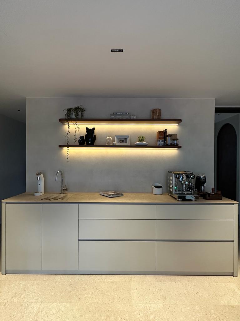 a place to call home finally - Modern kitchen countertop, minimalist design, sleek cabinets, integrated sink, pendant