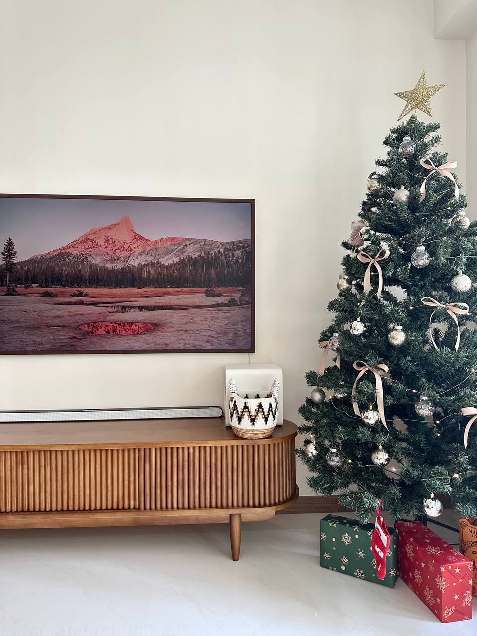 A self-designed flat with lots of neutrals & wood - Christmas tree, decorated, ornaments, lights, painting, mountain