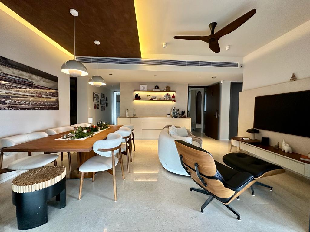 a place to call home finally - Modern dining room with sleek furniture, wooden dining table, white chairs, pendant lights