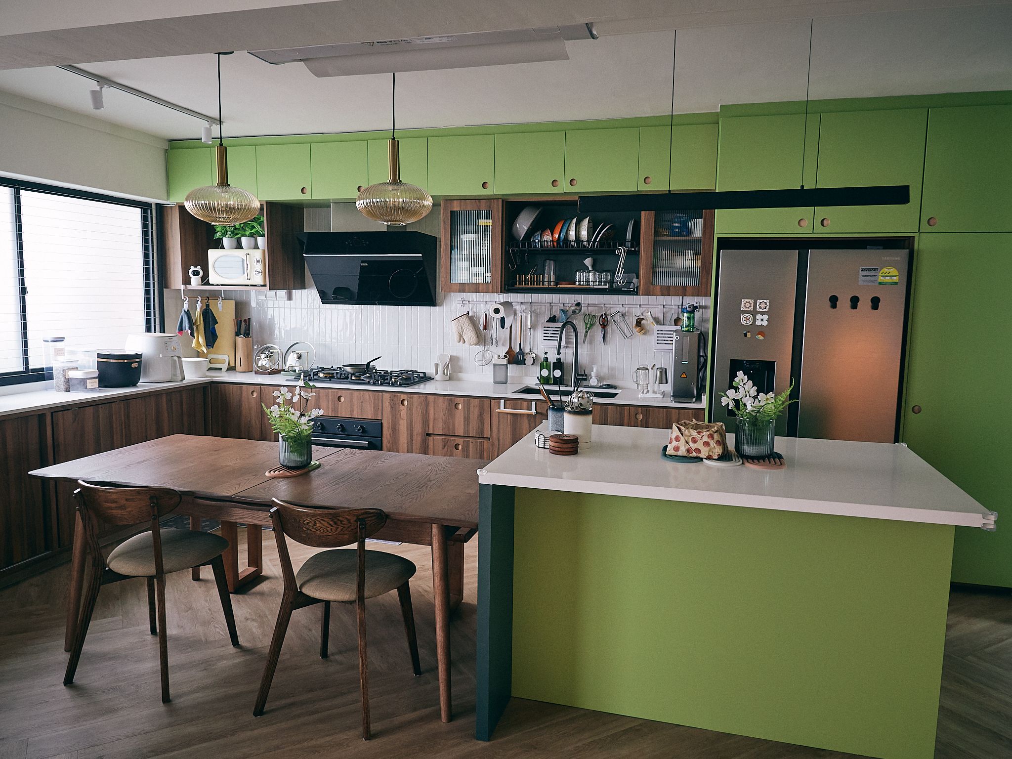 A family home with a vintage charm - modern kitchen, contemporary design, stylish cabinetry, green accent wall, stainless