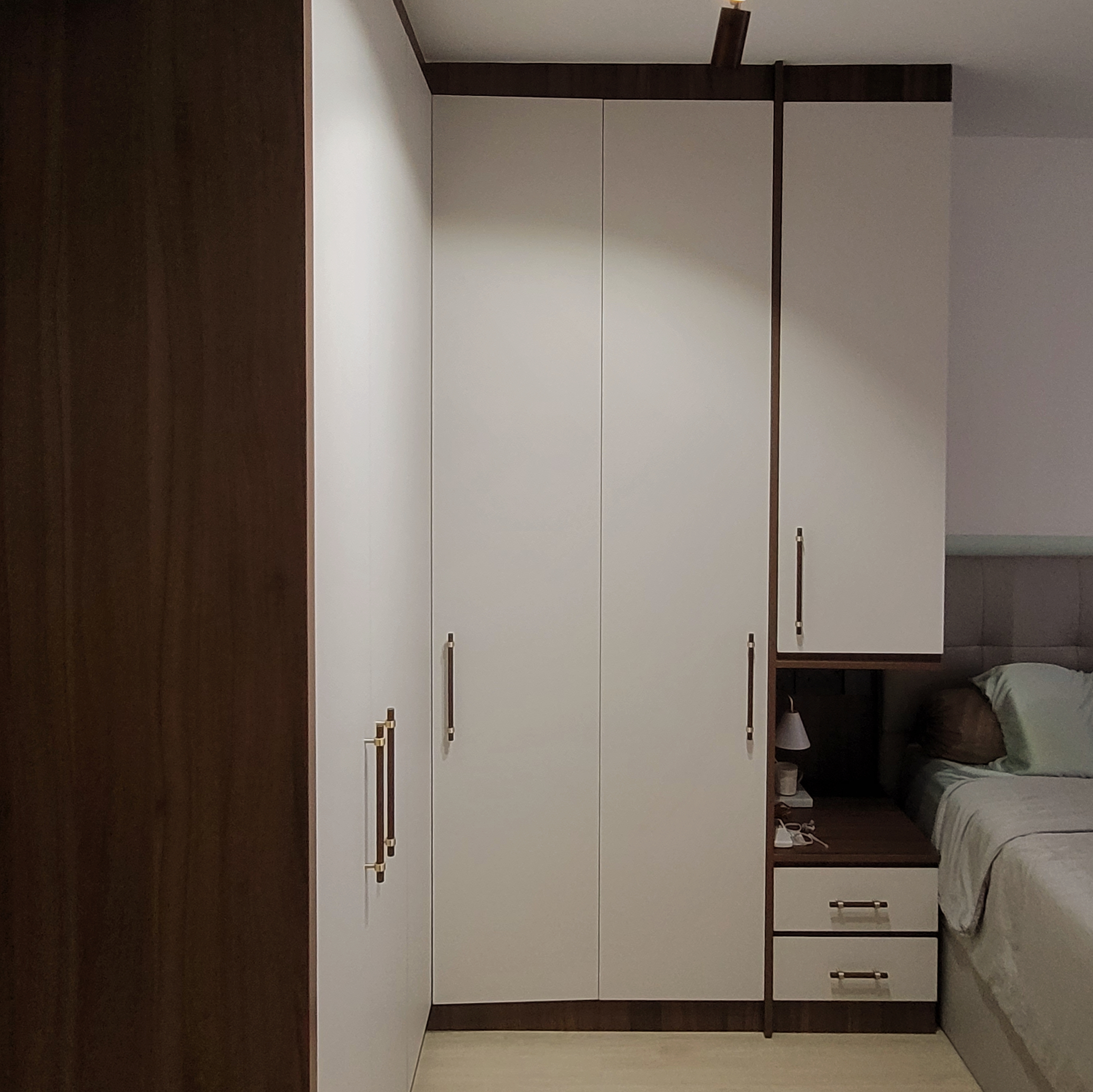 Step into our Modern Farmhouse with pops of Disney - White wardrobe with wooden accents, minimalist design, integrated