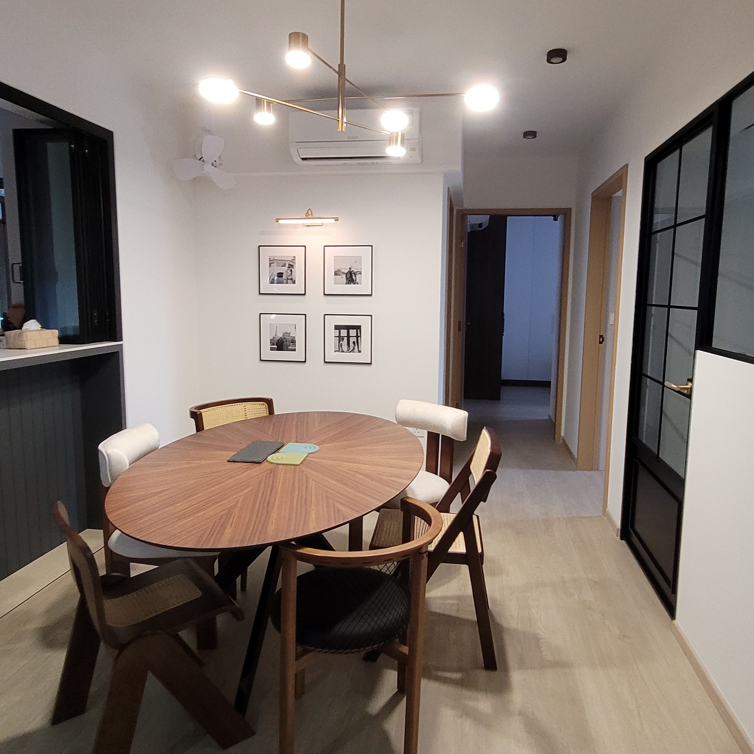 Step into our Modern Farmhouse with pops of Disney - Modern dining room with wooden table and chairs, minimalist design