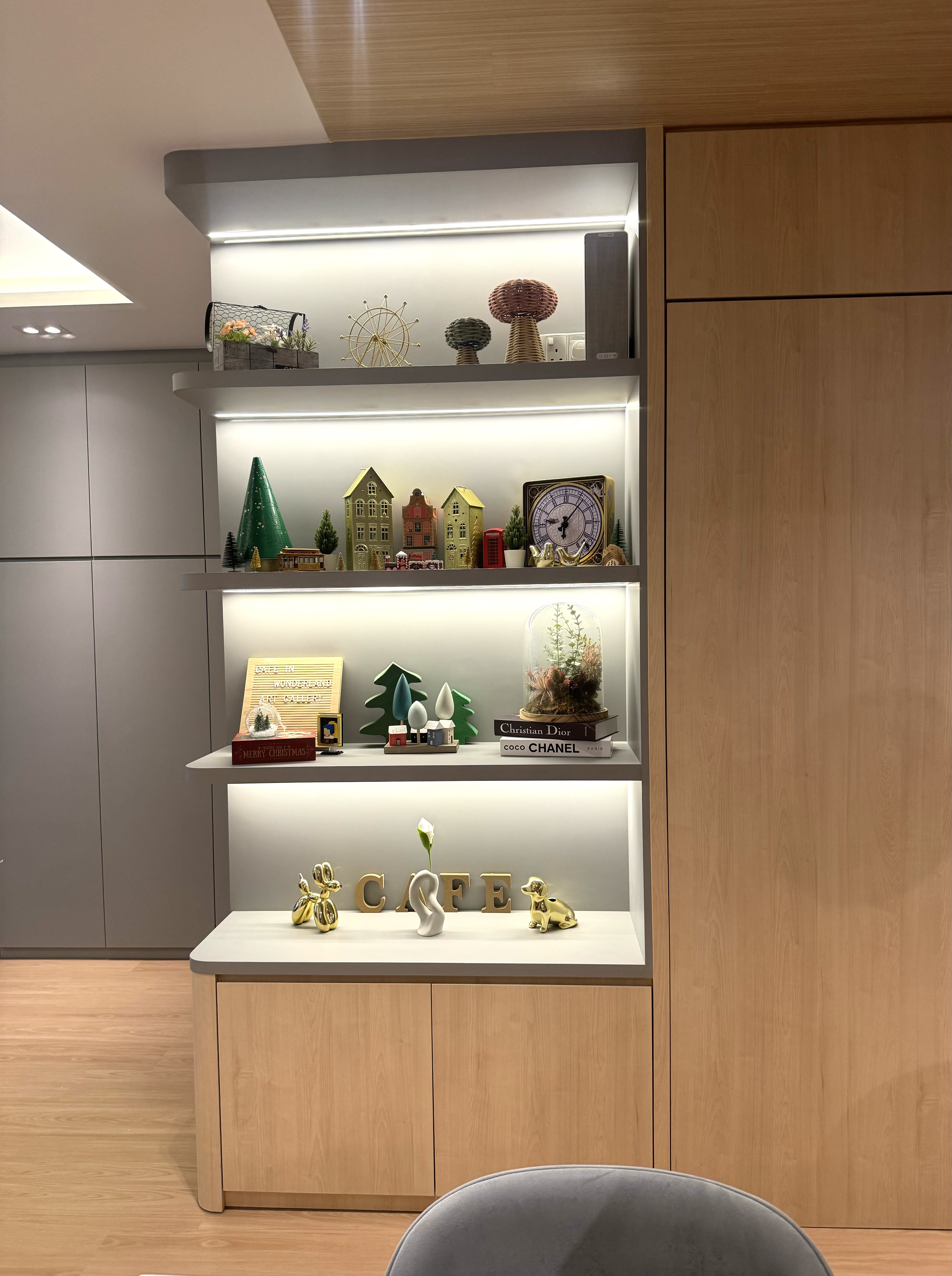 A Cafe Concept BTO in Tampines Greenverge - Modern minimalist interior, wooden shelves, decorative items, festive ornaments