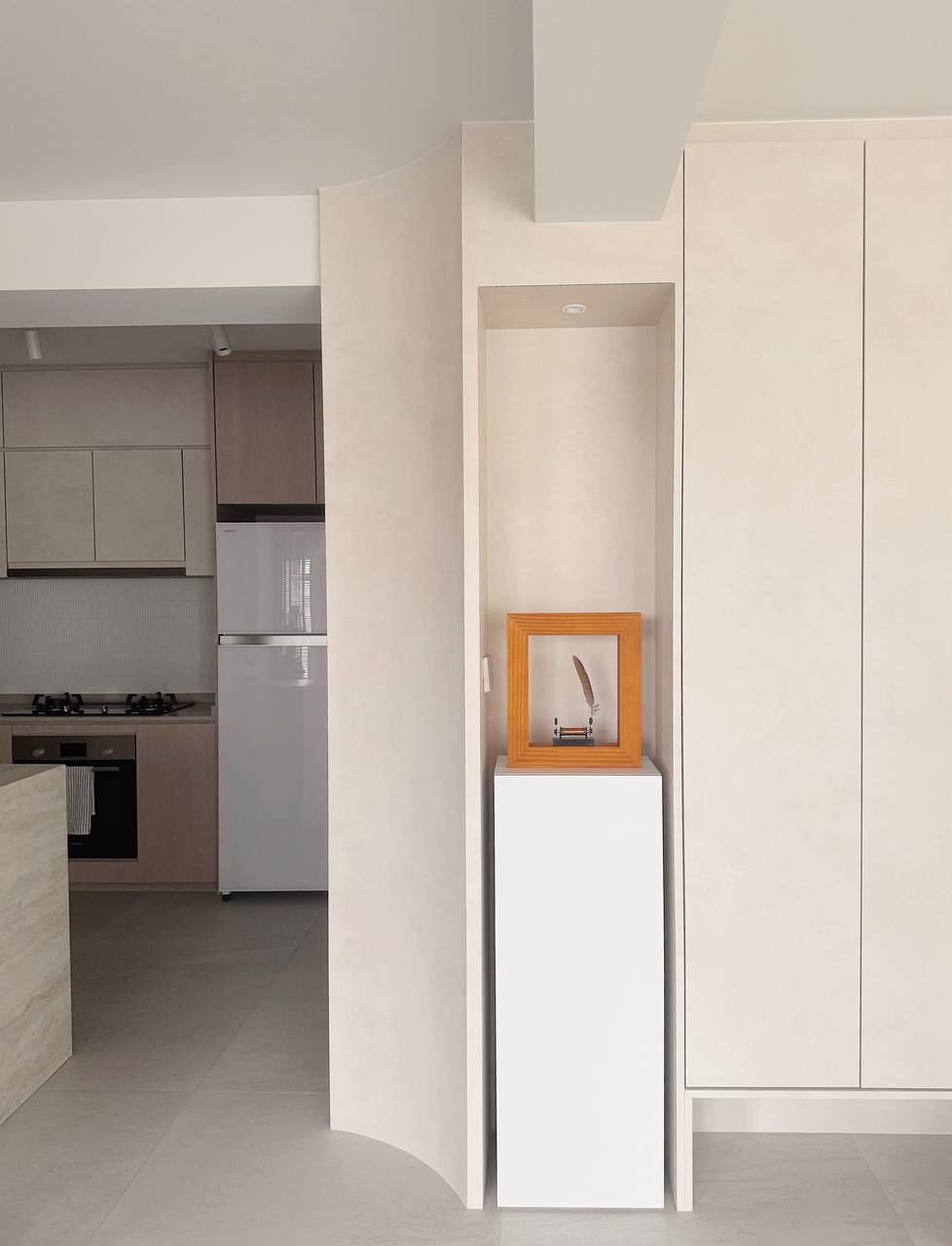 Cosy Apartment turns into Adaptable Spaces for Hosting - Modern kitchen with minimalist design, sleek white refrigerator