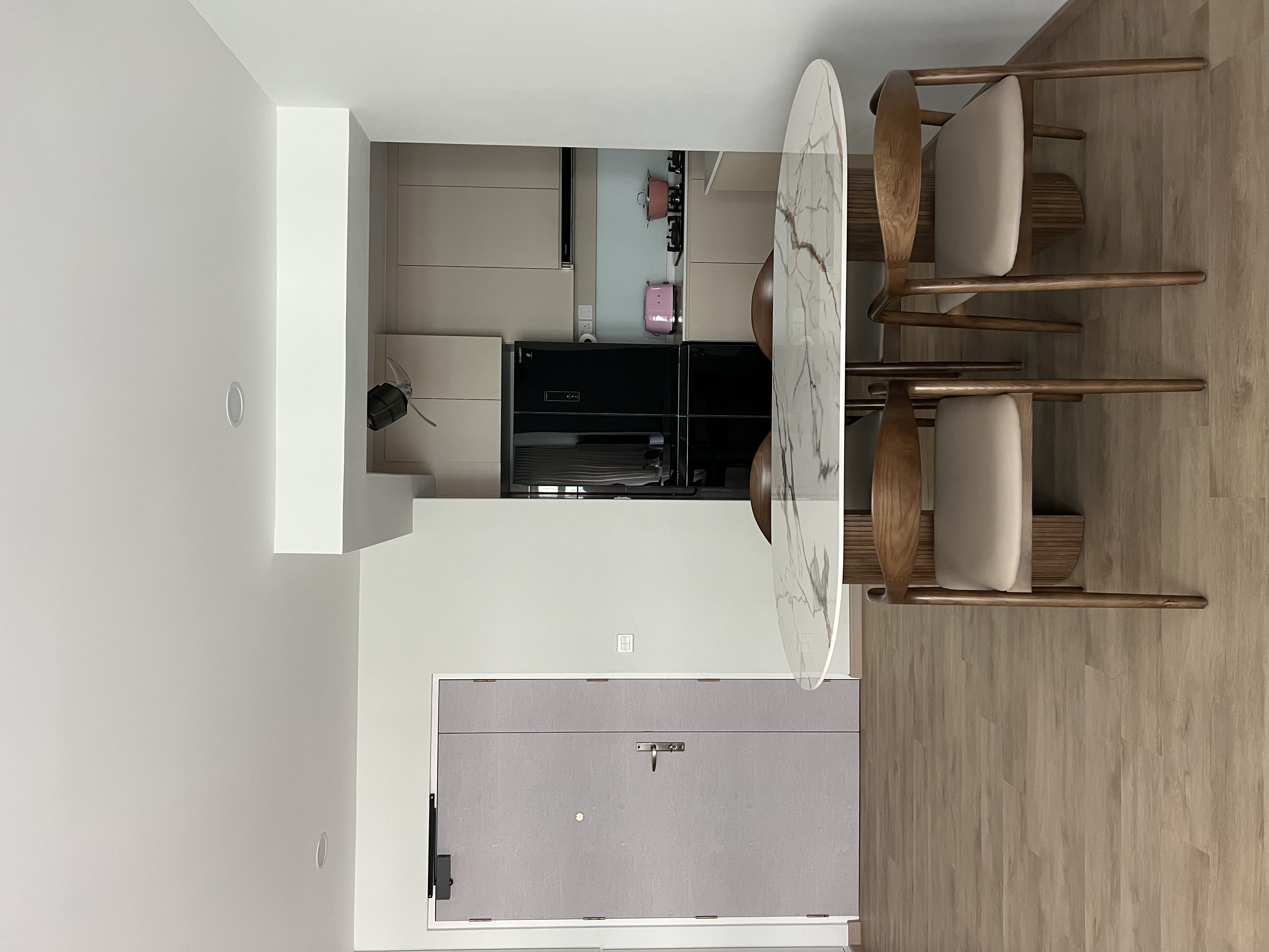 A minimalist home with “50 shades of beige” 😆 - Modern minimalist kitchen, sleek appliances, wooden dining chairs, marble