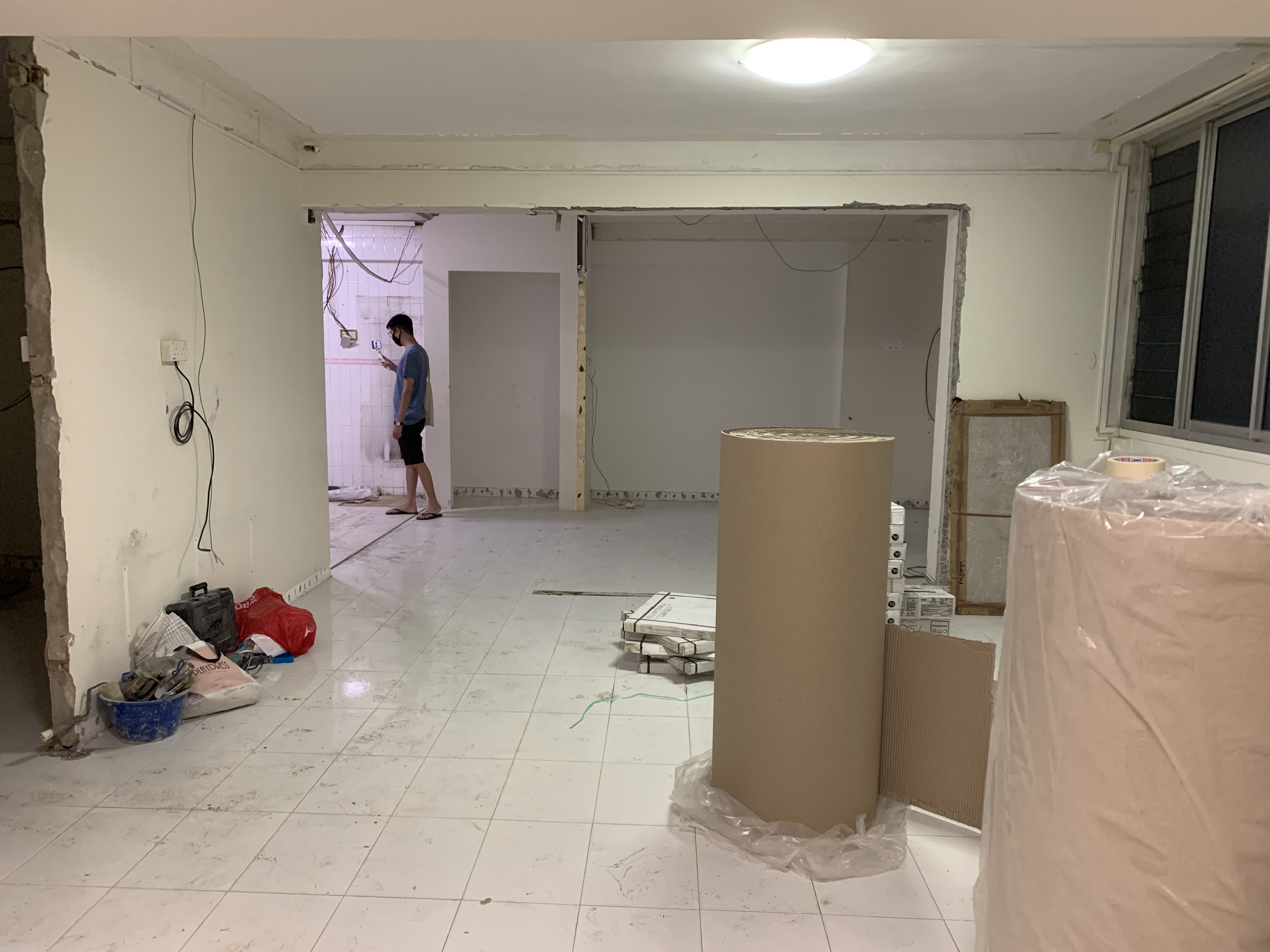 Transforming A 30 Year Old Resale HDB - We Bought After 1 Viewing - unfinished room, renovation in progress, man standing
