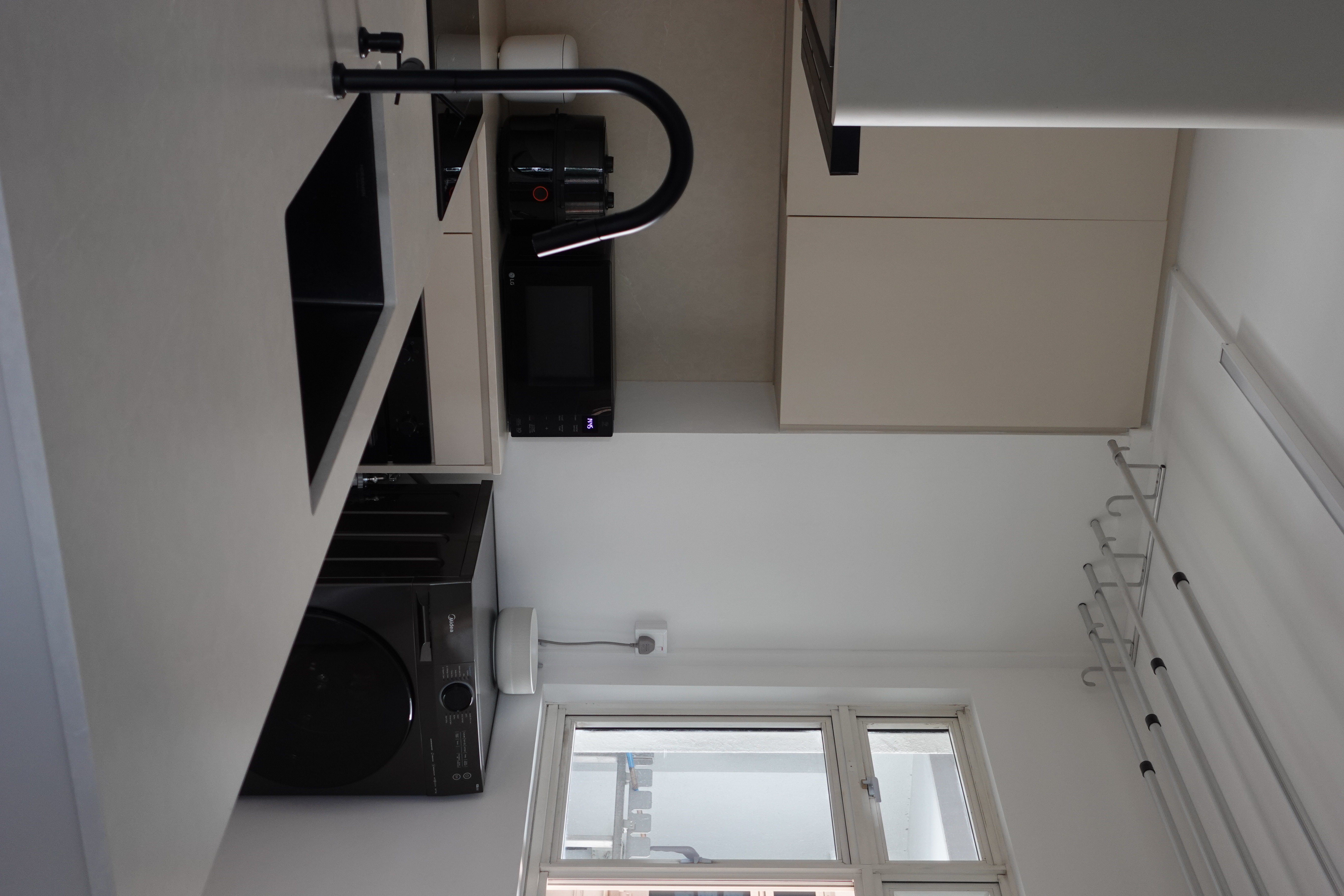 O hey there, welcome to our "minimalist" home   - Modern kitchen interior, minimalist design, sleek appliances, black coffee