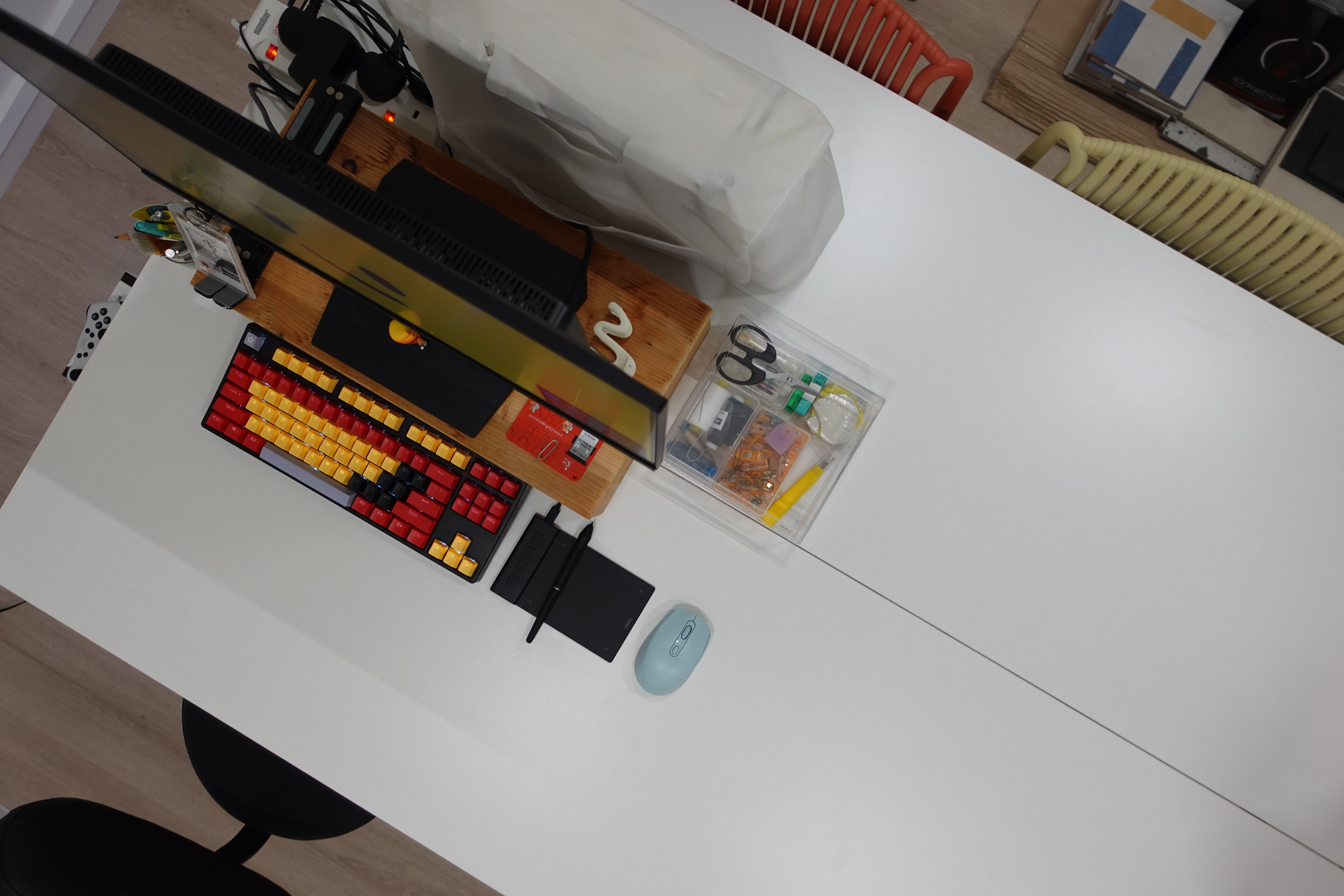 O hey there, welcome to our "minimalist" home   - Modern workspace with ergonomic keyboard and mouse, Colorful computer setup